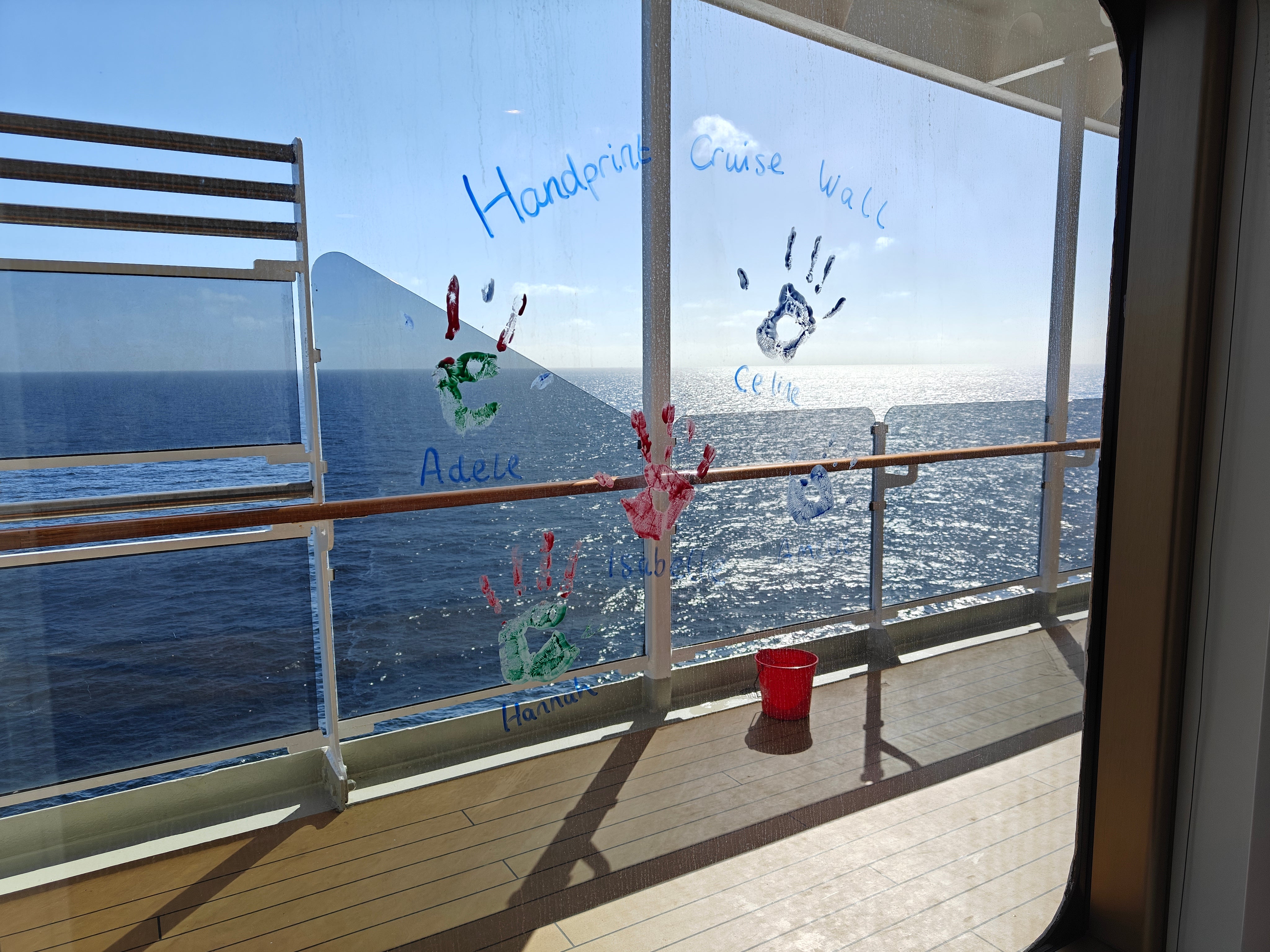 Cunard's young passengers leave a hand print on the kids' club window during sailings