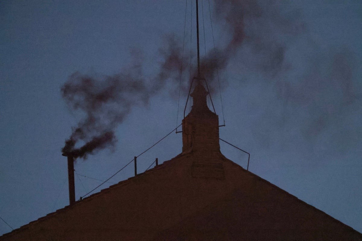 Black smoke surfaces from the Vatican's Sistine Church, signaling the pope elected in the first conference vote (photo)