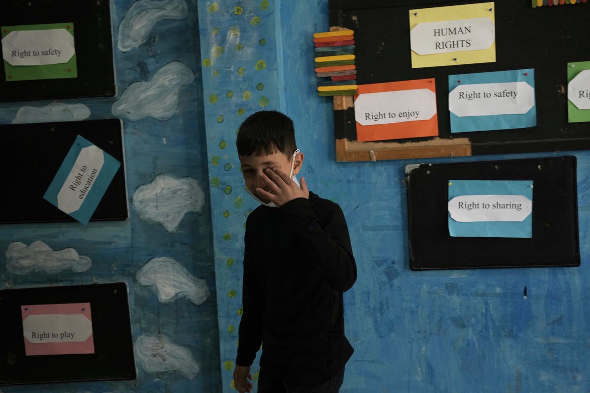 AP PHOTOS: Israel police fire tear gas into Palestinian schoolyard in Jerusalem