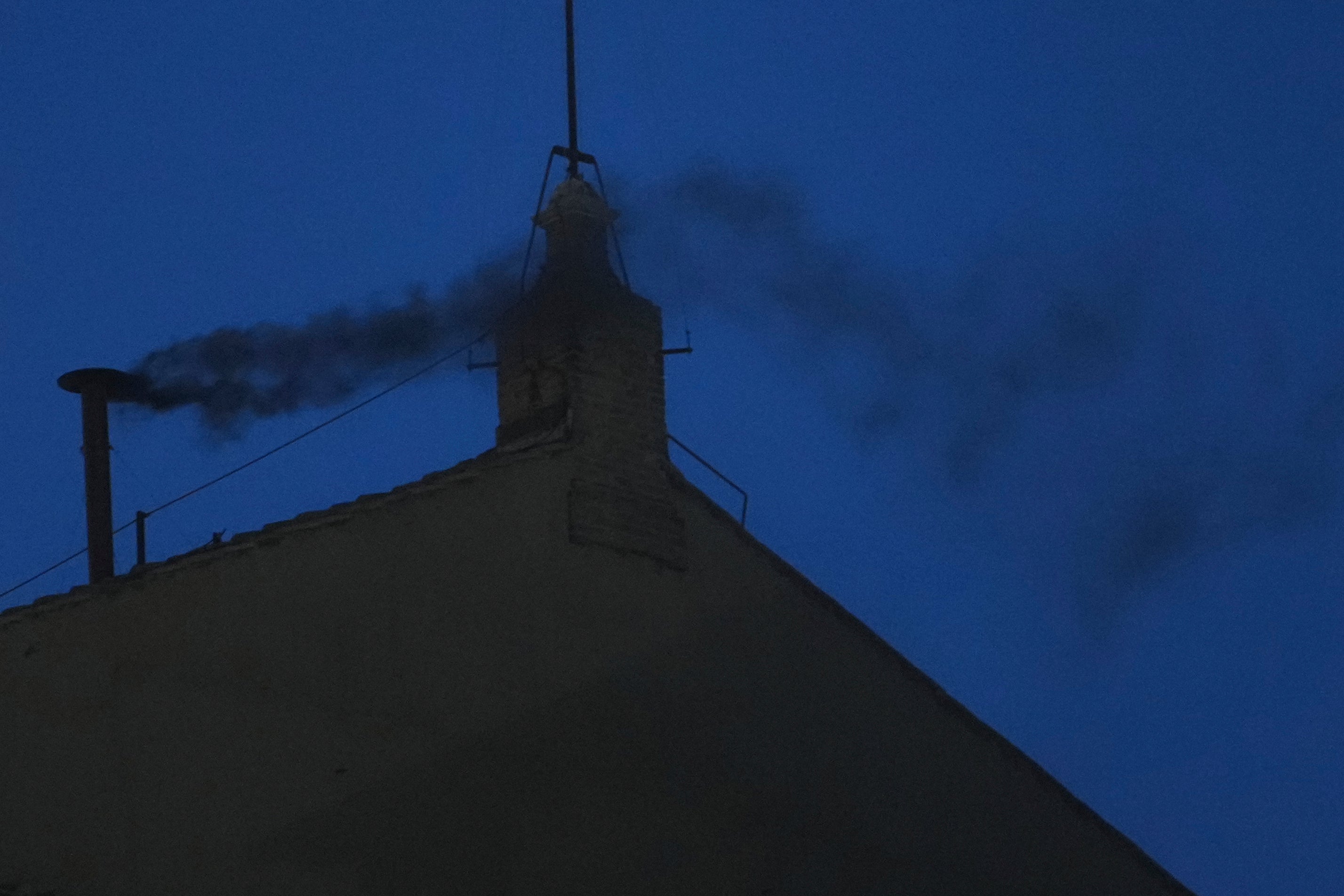 Black smoke billows from the chimney of the Sistine Chapel during the cardinals' conclave to elect a new pope, at the Vatican