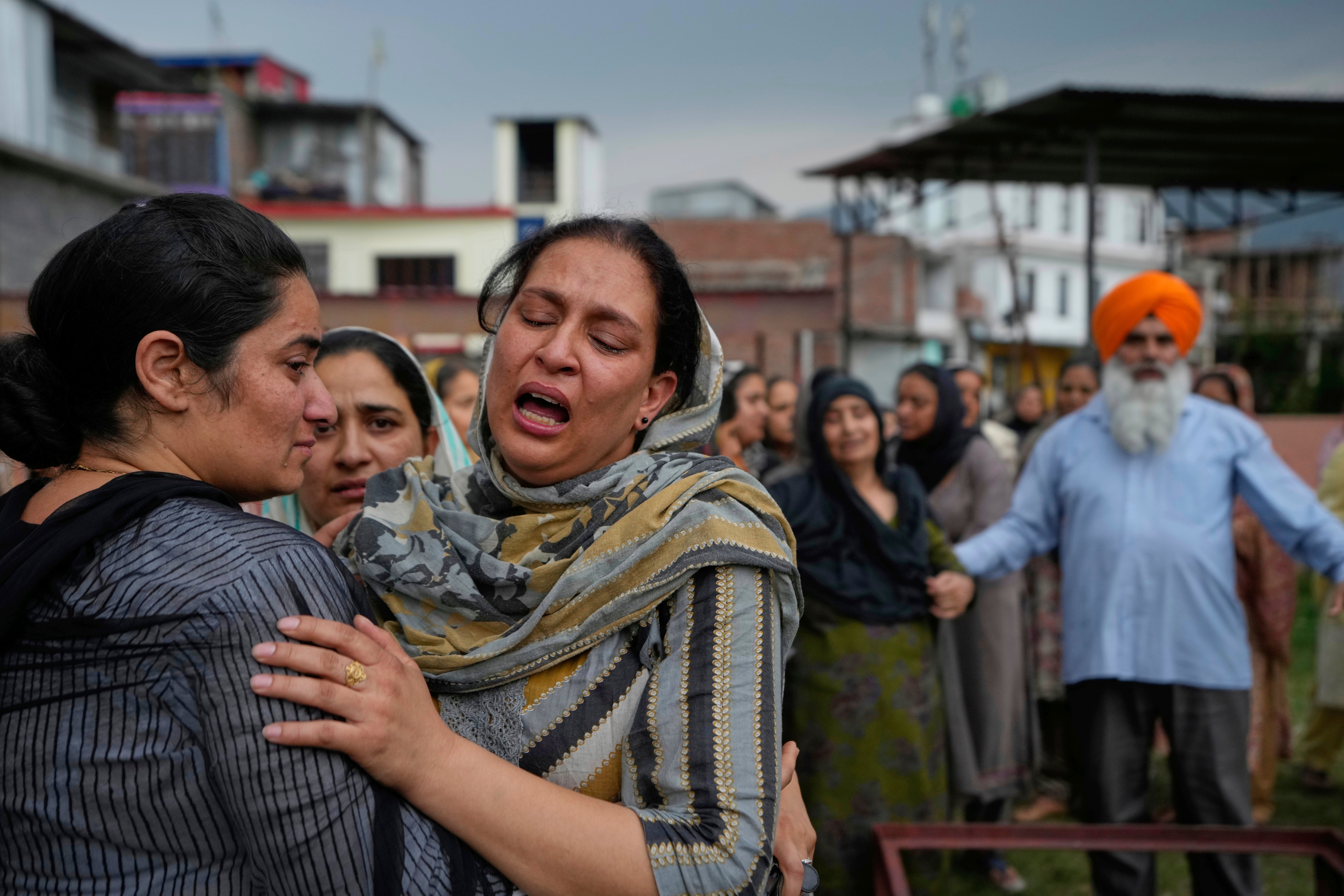 Wife of Amarjeet Singh, 51, killed in Pakistani artillery shelling wails during cremation, in Poonch along the Line of Control, Indian controlled Kashmir
