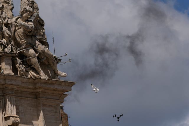 Black smoke billows from the chimney of the Sistine Chapel on the morning of day two of the conclave (AP Photo/Luca Bruno)