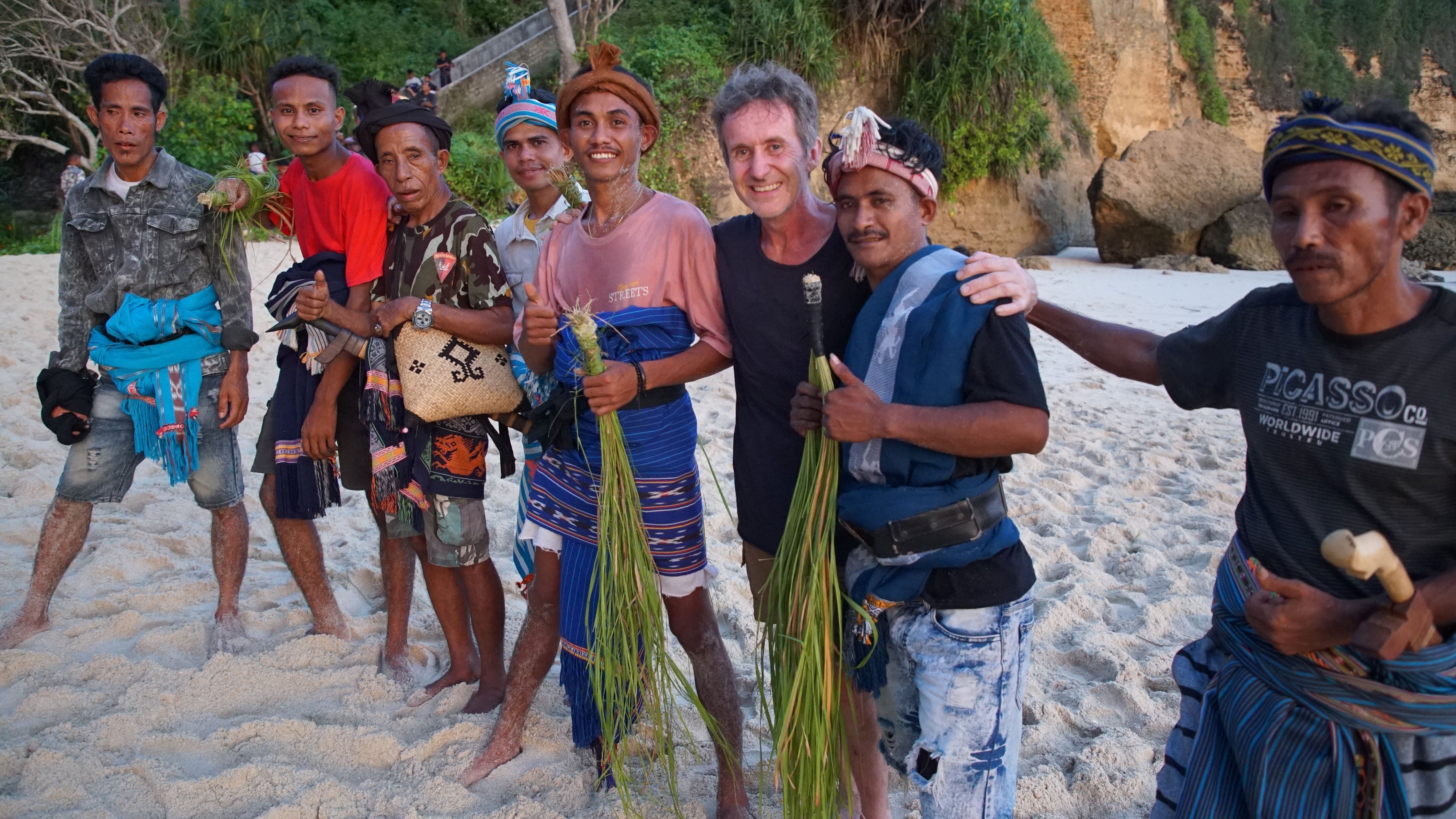 Parry on the beach in Sumba, with men ready to take part in a traditional ceremony