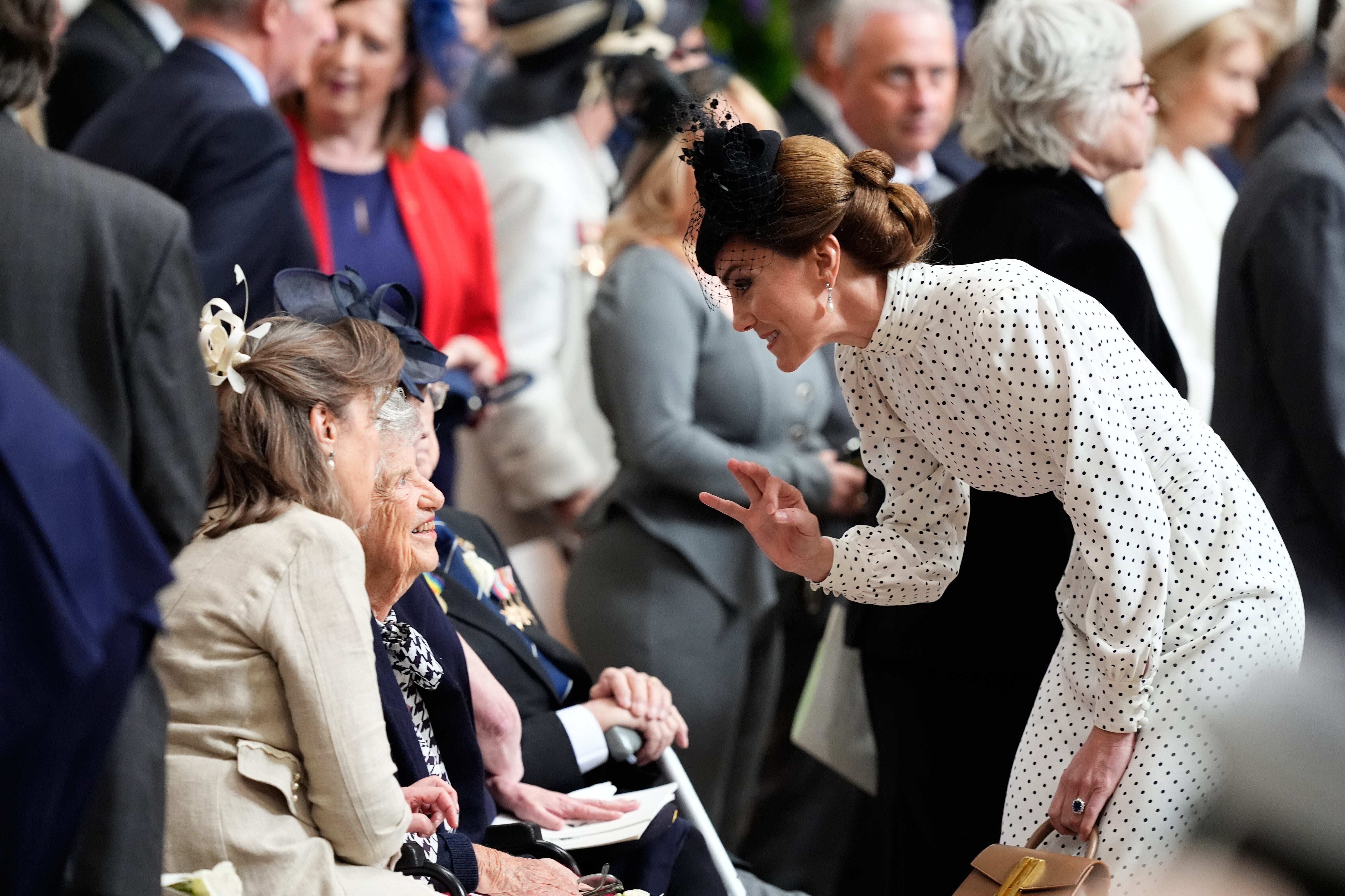 At the end of the service, the royal family took time to greet veterans as they left the abbey, and Camilla and Kate lay flowers at the Innocent Victims' Memorial.