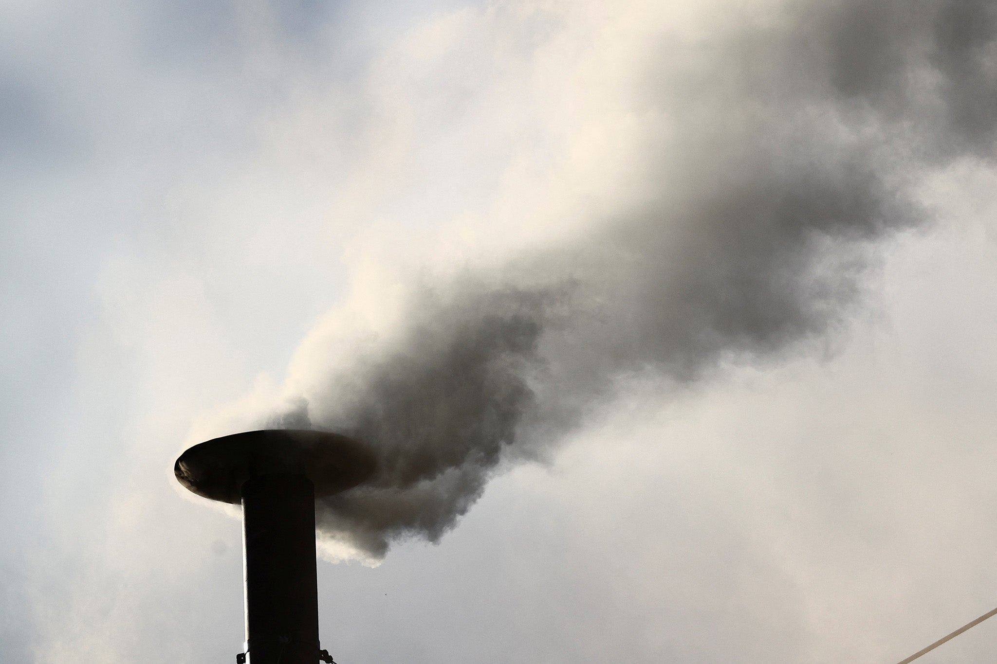 White smoke rises from the chimney of the Sistine Chapel