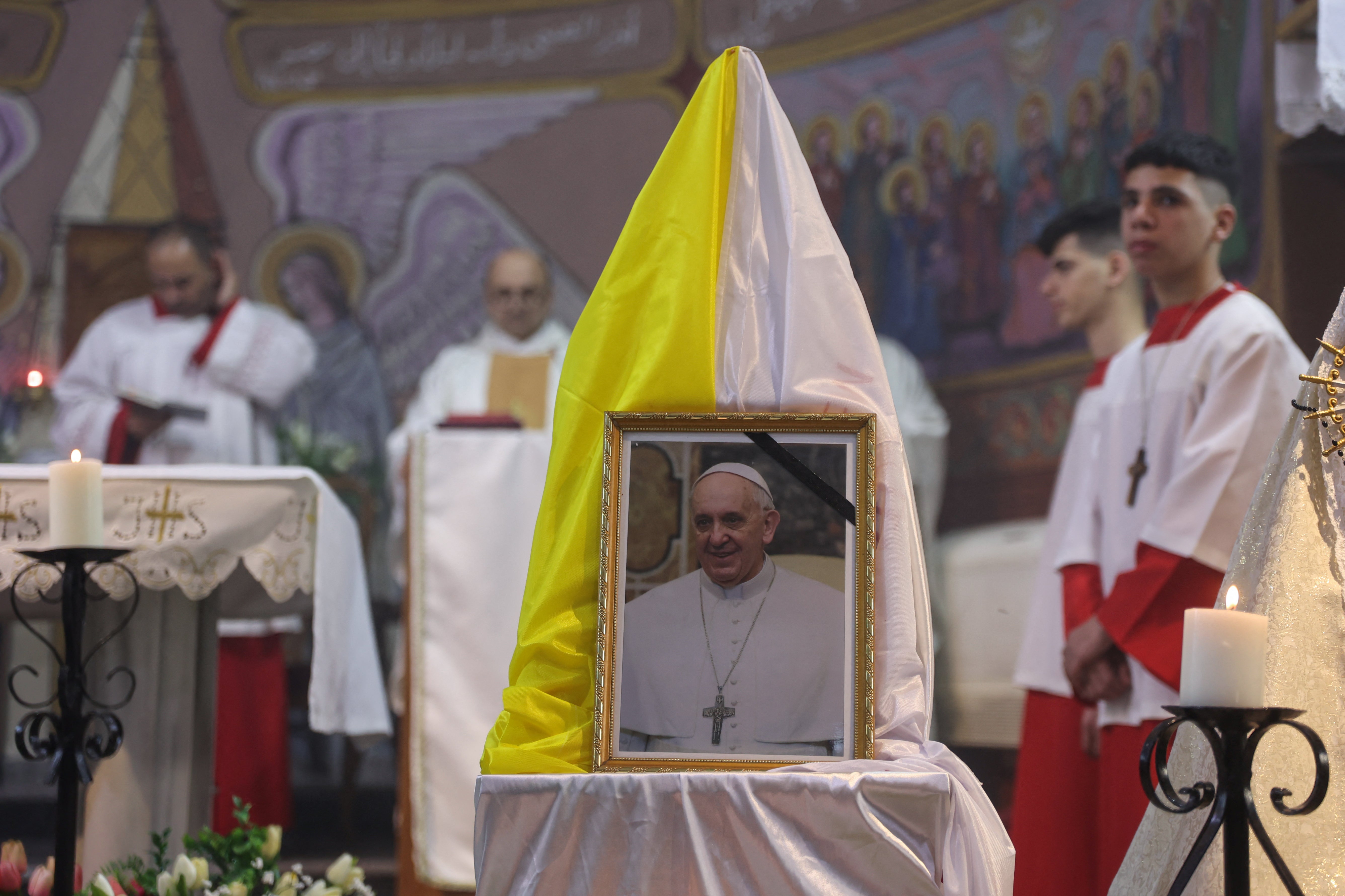 Palestinian clergymen hold mass for late Pope Francis at the Holy Family Church in Gaza on April 21