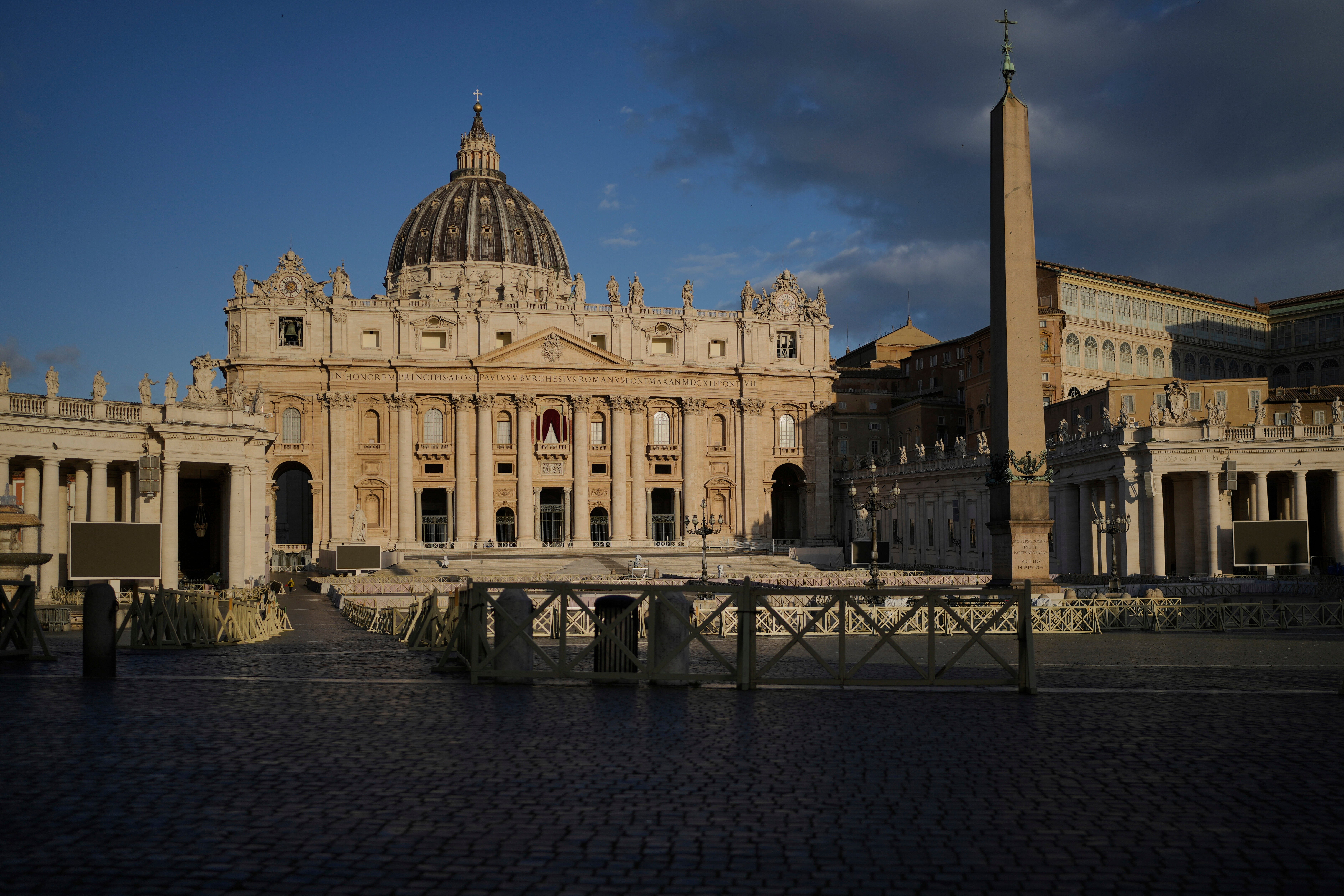 The morning sun shines on the Saint-Pierre Basilica with the Sistine Chapel in the background, where the cardinals elect a new pope during the Vatican Conclave
