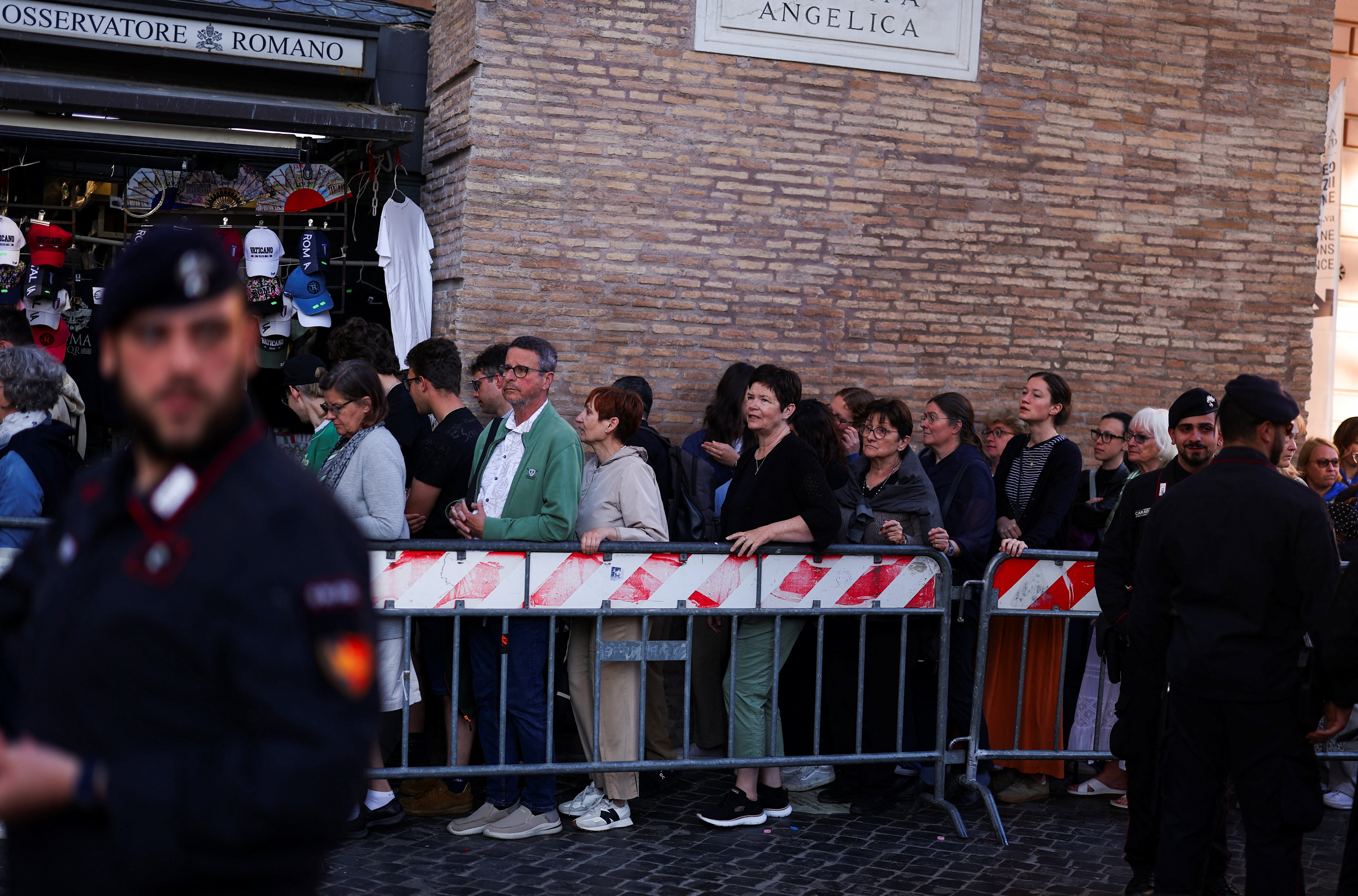 People queue to enter St Peter Square Thursday morning