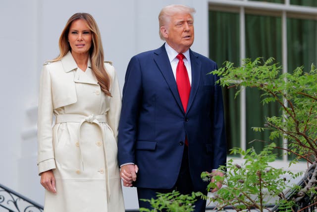 <p>Melania Trump, pictured beside her husband, President Donald Trump, has stayed fewer than 14 days at the White House, sources say </p>