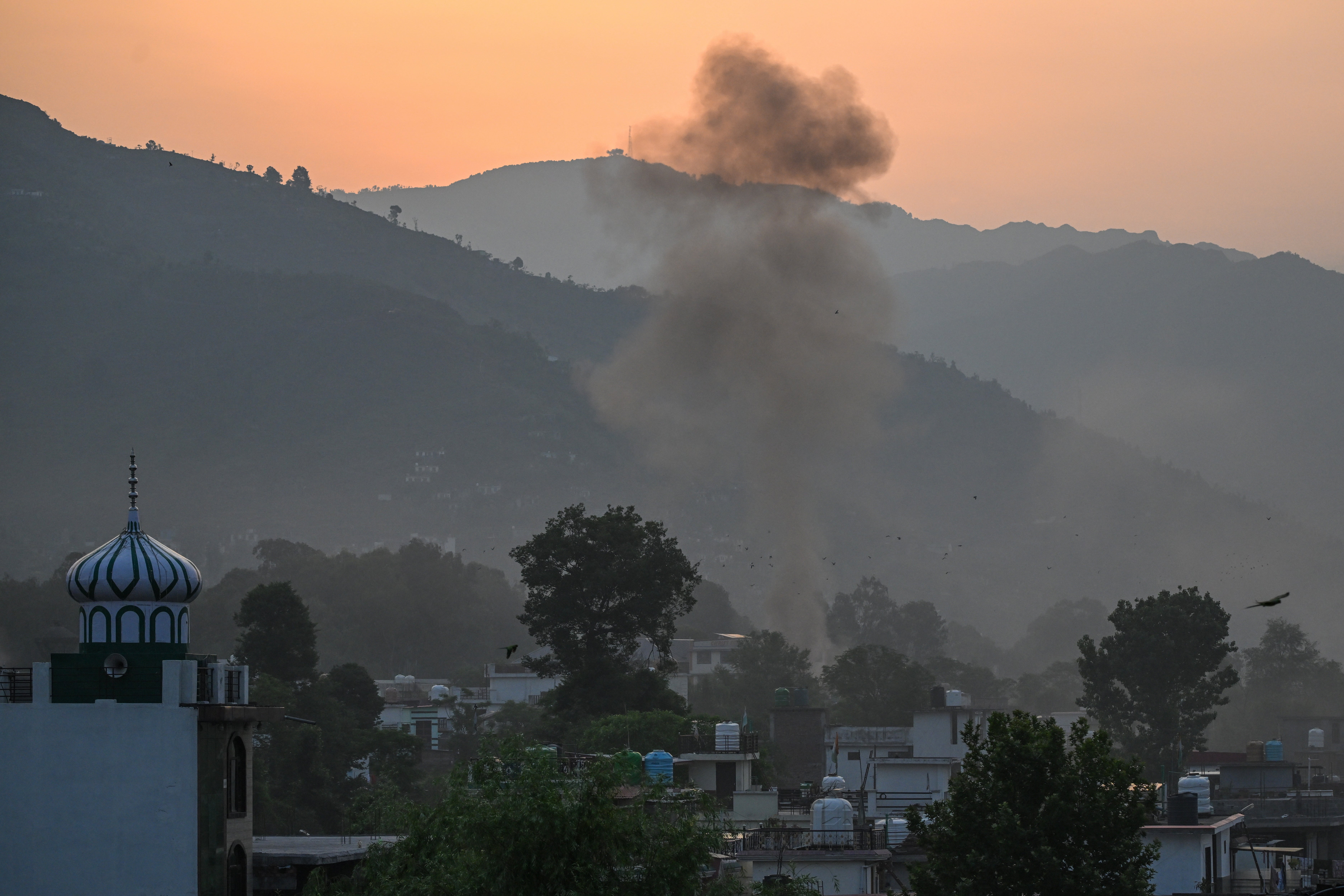 <p>Smoke rises in the main town of Poonch district on 7 May 2025</p>