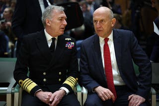Britain's chief of the defence Staff Tony Radakin (L) speaks to Britain's defence secretary John Healey at the London Defence Conference in central London