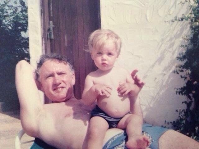 <p>John with his dad David as a young boy (John Ramsay/PA)</p>