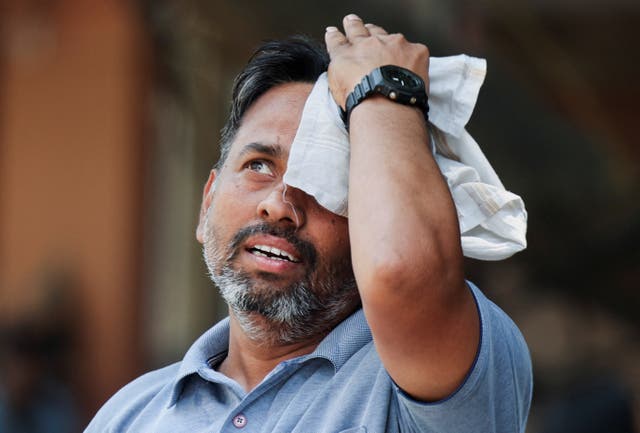 <p>File. A man watches market results on a screen outside the Bombay Stock Exchange (BSE) in Mumbai, India, 7 April 2025</p>