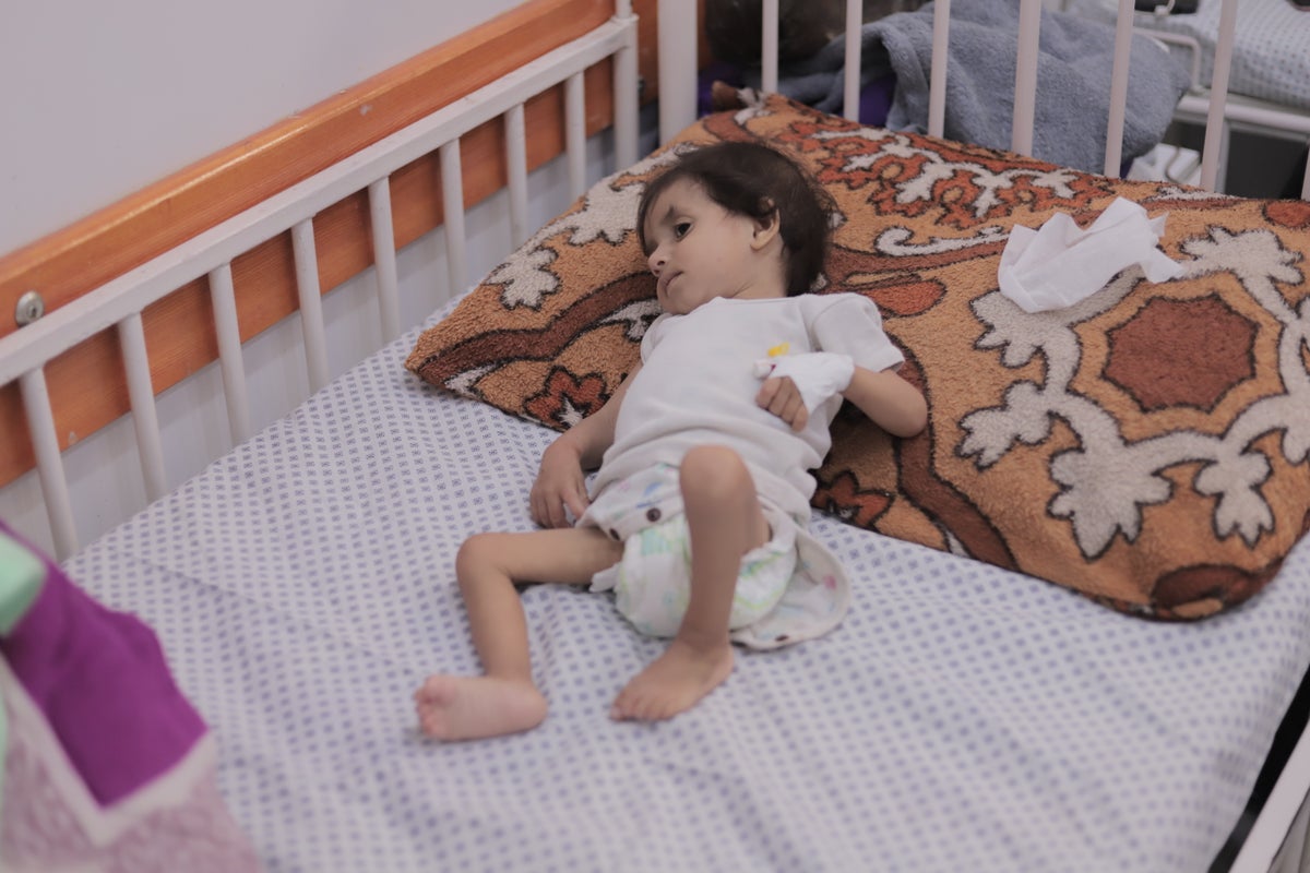 Gaza’s forgotten victims: Starving one-year-old Siham, swamped in newborn clothes