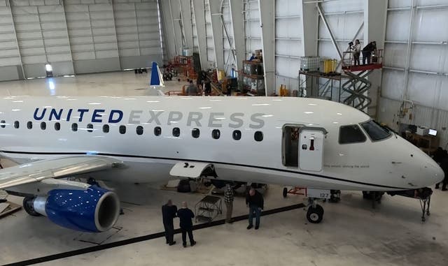 <p>A United regional jet being fitted with Starlink</p>