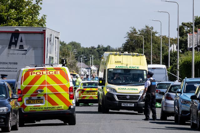 <p>Police vehicles and ambulances in Southport following the attack</p>