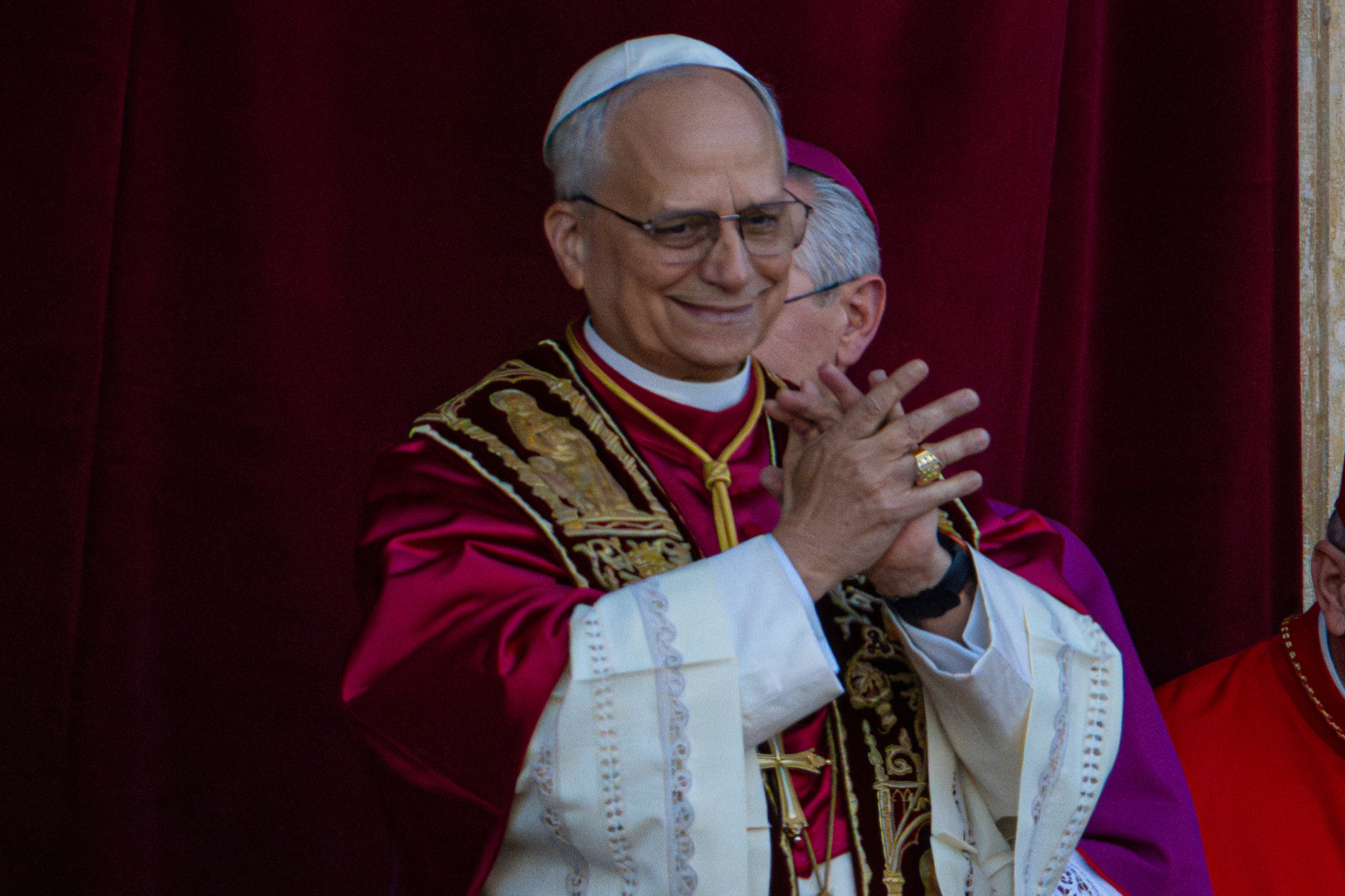Newly elected Pope Leo XIV, formerly Cardinal Robert Francis Prevost, appears on the central loggia of St. Peter's Basilica at the Vatican. The American Pope will now lead the world’s 1.4 billion Catholics, while President Donald Trump will lead America the nation.