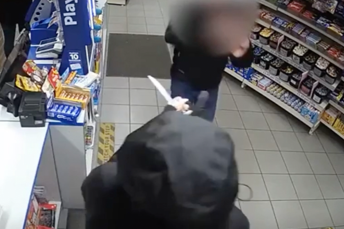 Shop worker confronts knife-wielding robber with bare hands after female colleague threatened