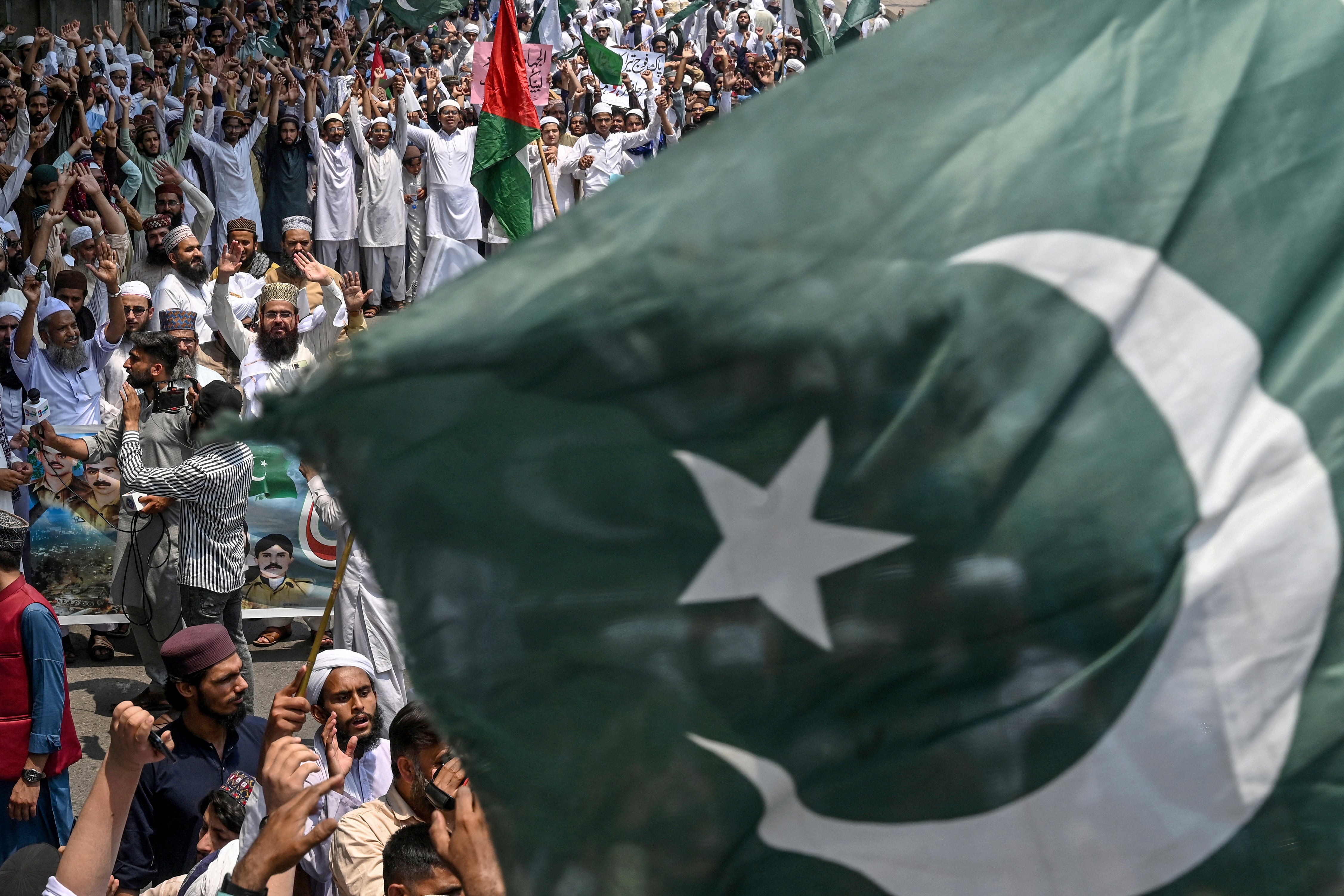 Supporters of the Pakistan Markazi Muslim League party shout slogans during an anti-India protest in Lahore on 10 May 2025