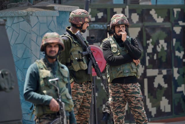 <p>Indian army soldiers stand guard after loud explosions were heard in Srinagar, Indian controlled Kashmir</p>