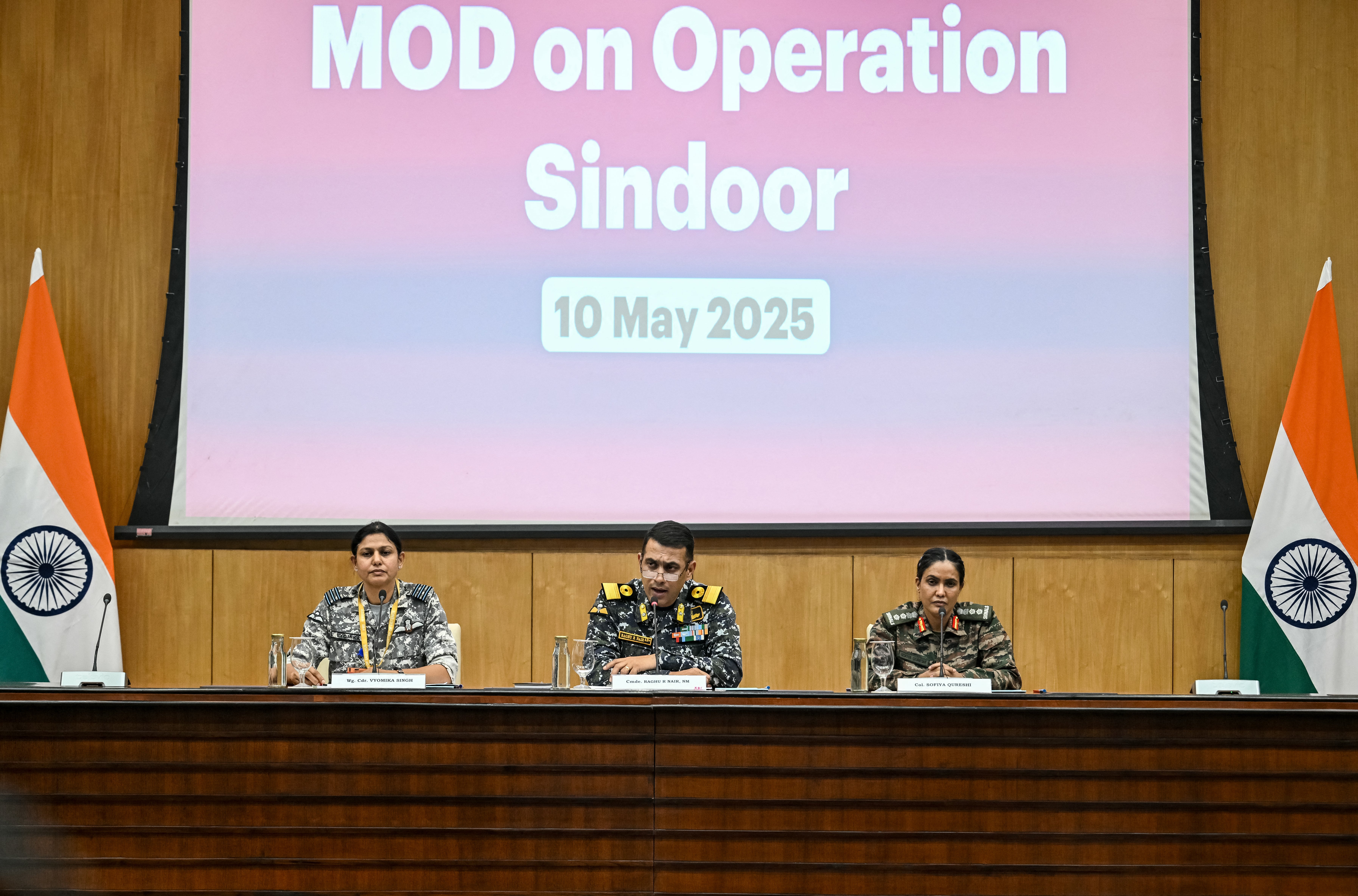 Wing Commander Vyomika Singh (L), Naval Commodore Raghu R Nair (C) and Indian Army Colonel Sophia Qureshi speak during a press briefing, at the Ministry of External Affairs (MEA) in New Delhi on May 10, 2025.