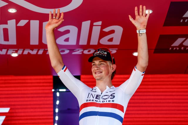 <p>Josh Tarling celebrates after winning stage two in Tirana</p>