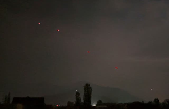 <p>Red projectiles are seen over Srinagar in Kashmir on Saturday evening</p>