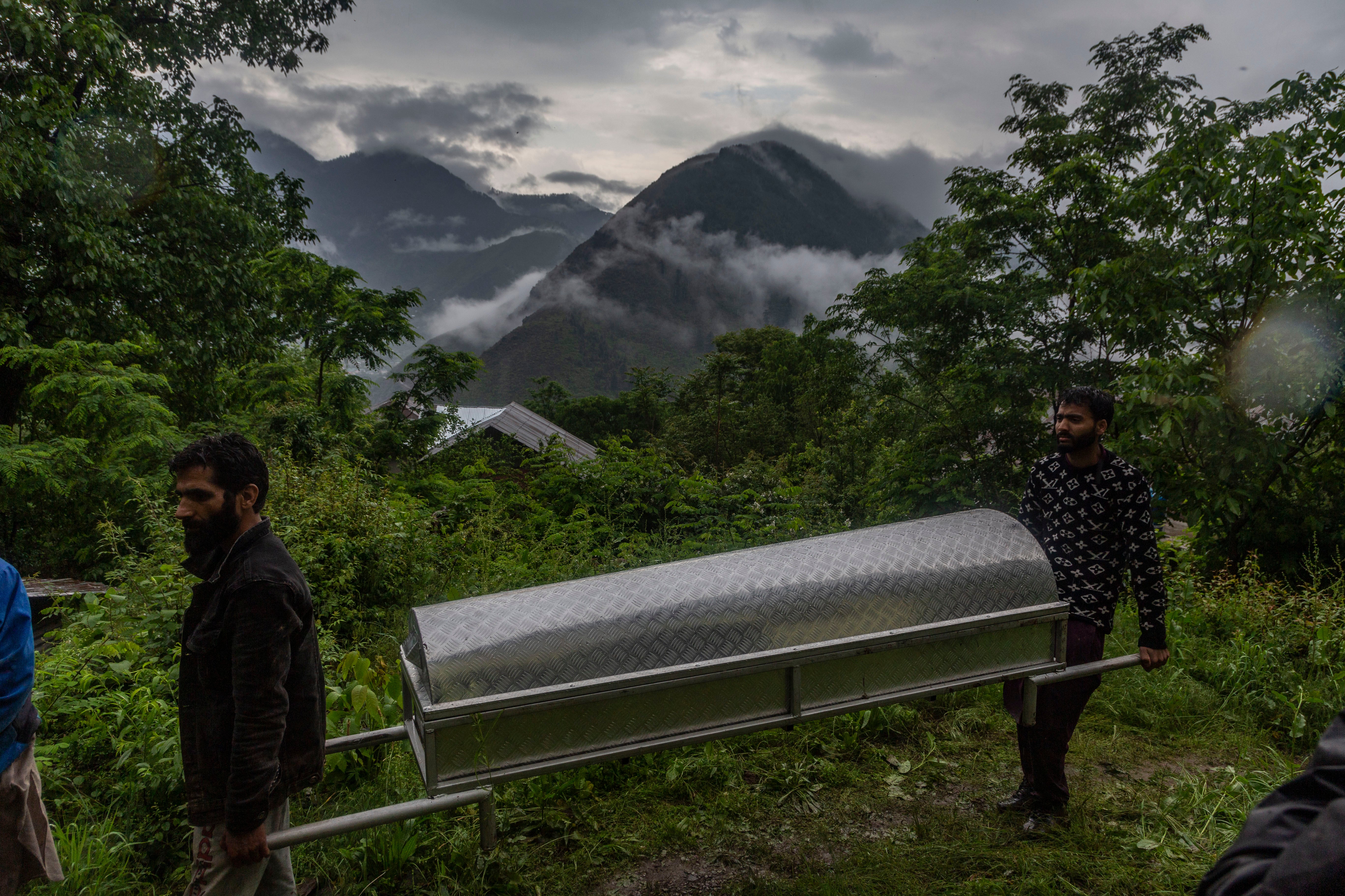 Kashmiri Muslims carry bier after burping Nargis Begum, who was killed in artillery shelling allegedly performed Pakistani strength in the city of Uri