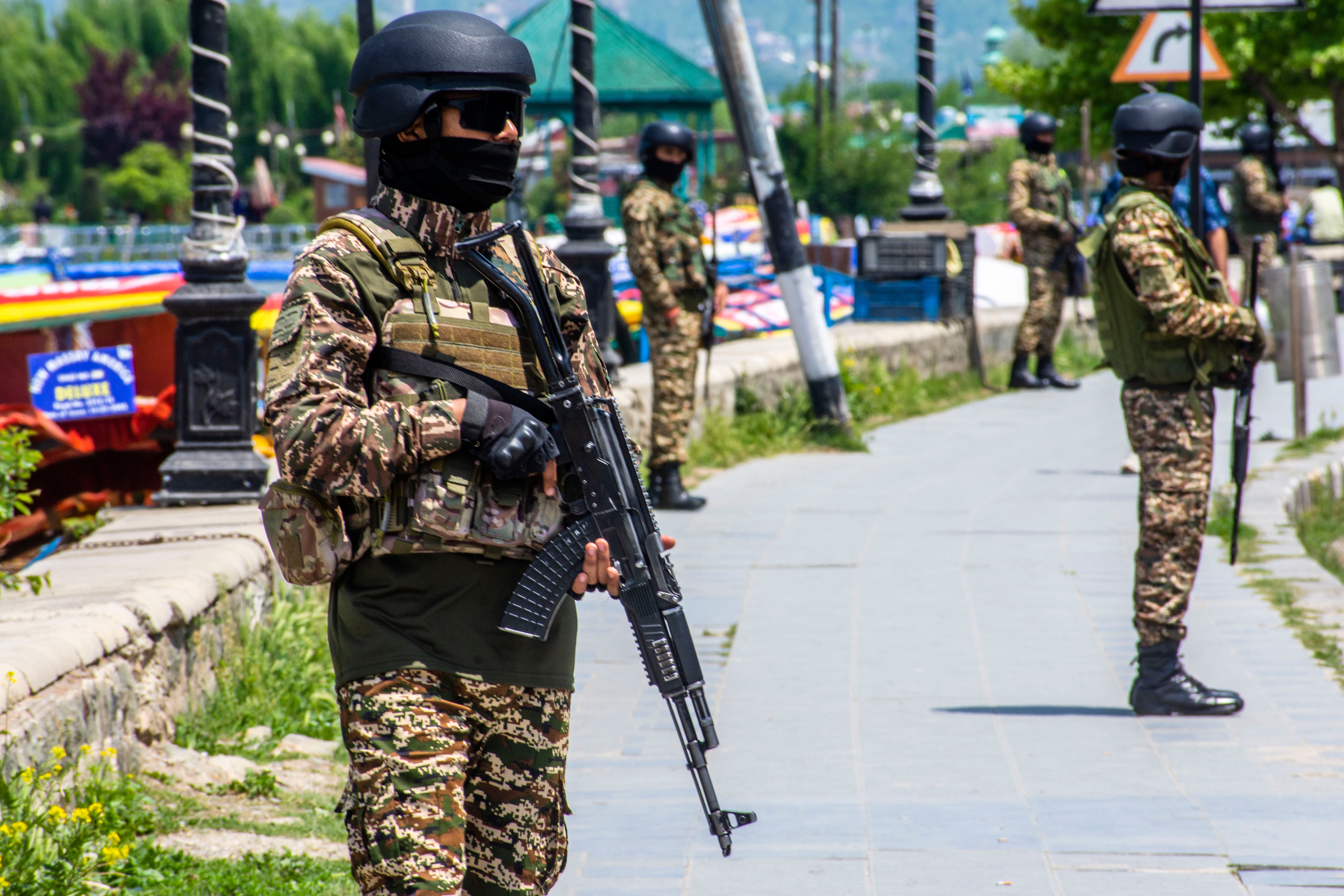 File Indian paramilitary soldiers stand guard in Kashmir