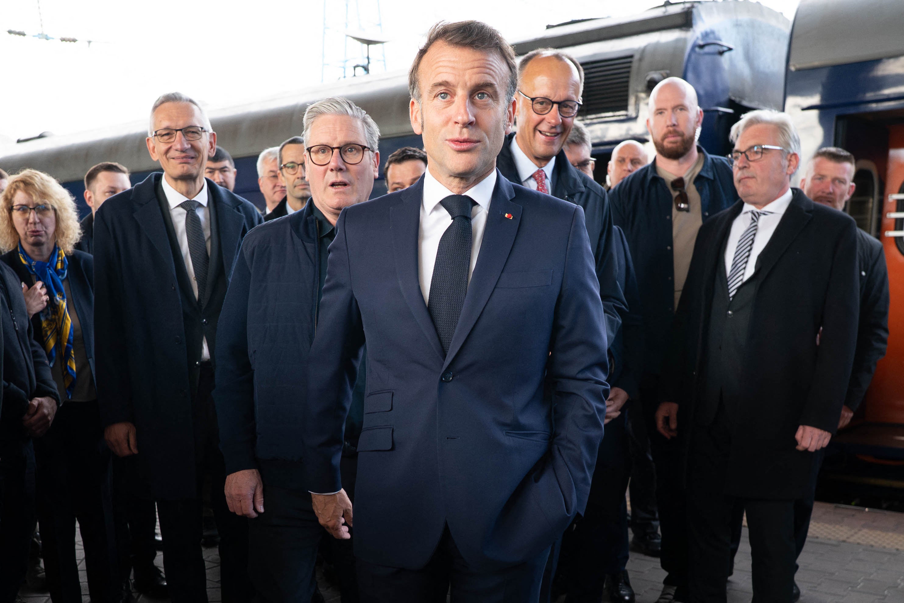 France's President Emmanuel Macron (C), Britain's Prime Minister Keir Starmer (L) and Germany's Chancellor Friedrich Merz (R) arrive at Kyiv railway station on May 10, 2025, ahead of a gathering of European leaders in the Ukranian capital