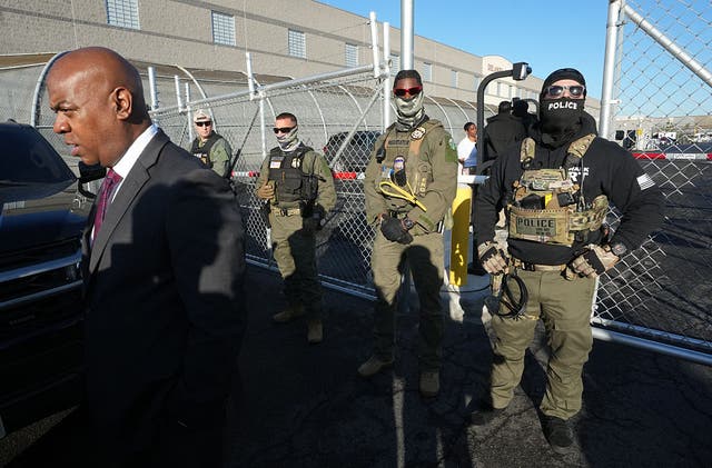 <p>ICE agents stand outside an immigrant detention center in Elizabeth, New Jersey May 7</p>