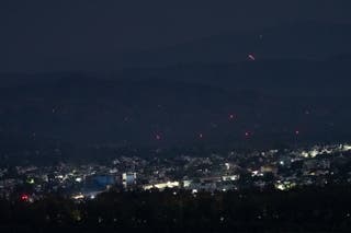 Streaks of light illuminate the sky as Indian air defence systems engage hostile objects on 10 May 2025 in Jammu, India