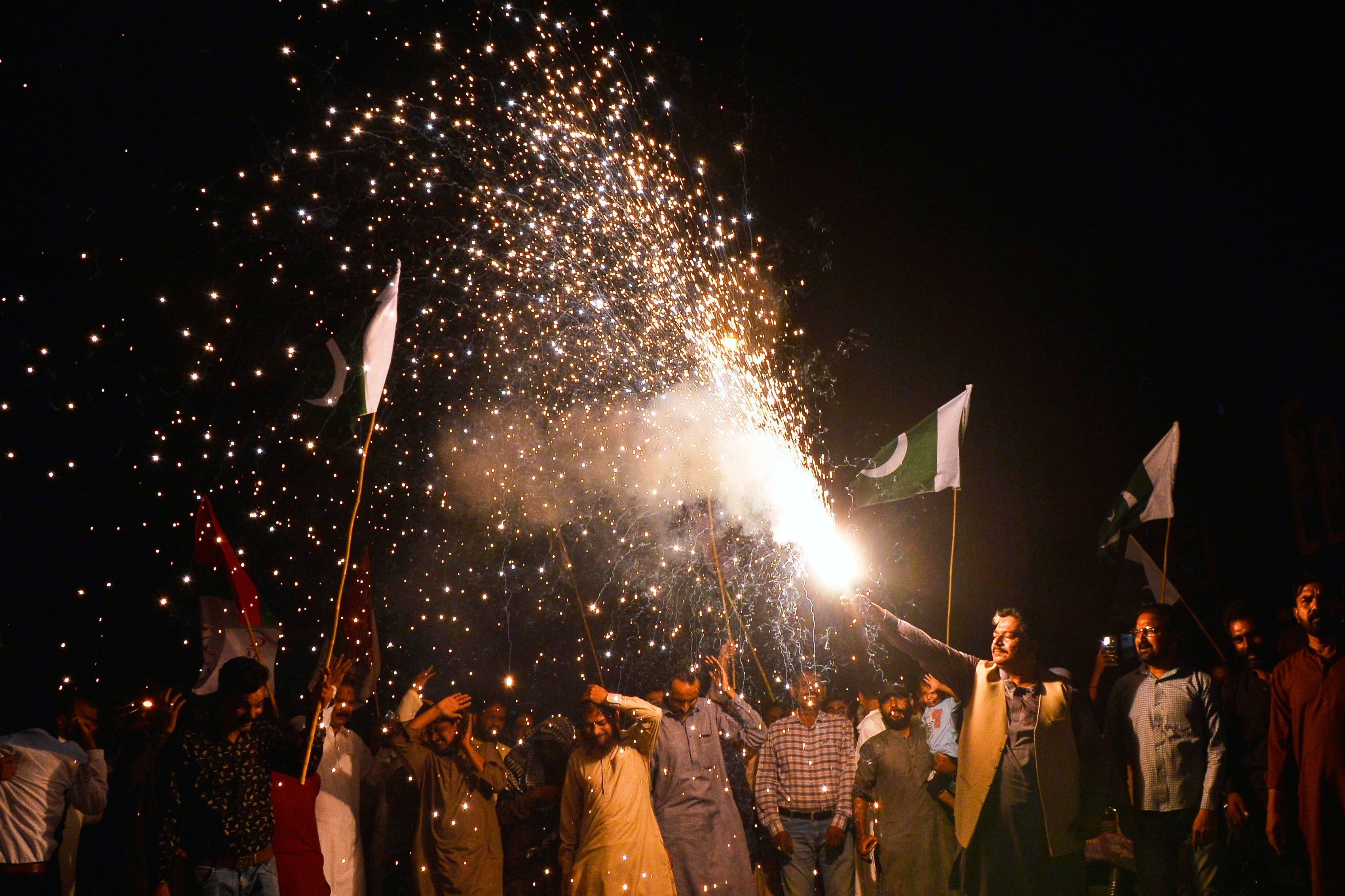 People light fireworks to celebrate Pakistan and India reaching a ceasefire deal, during a demonstration in Hyderabad, Pakistan, Saturday, 10 May 2025