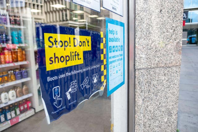 <p>A ‘Stop, Don’t Shoplift’ sign at a Boots shop in central London</p>