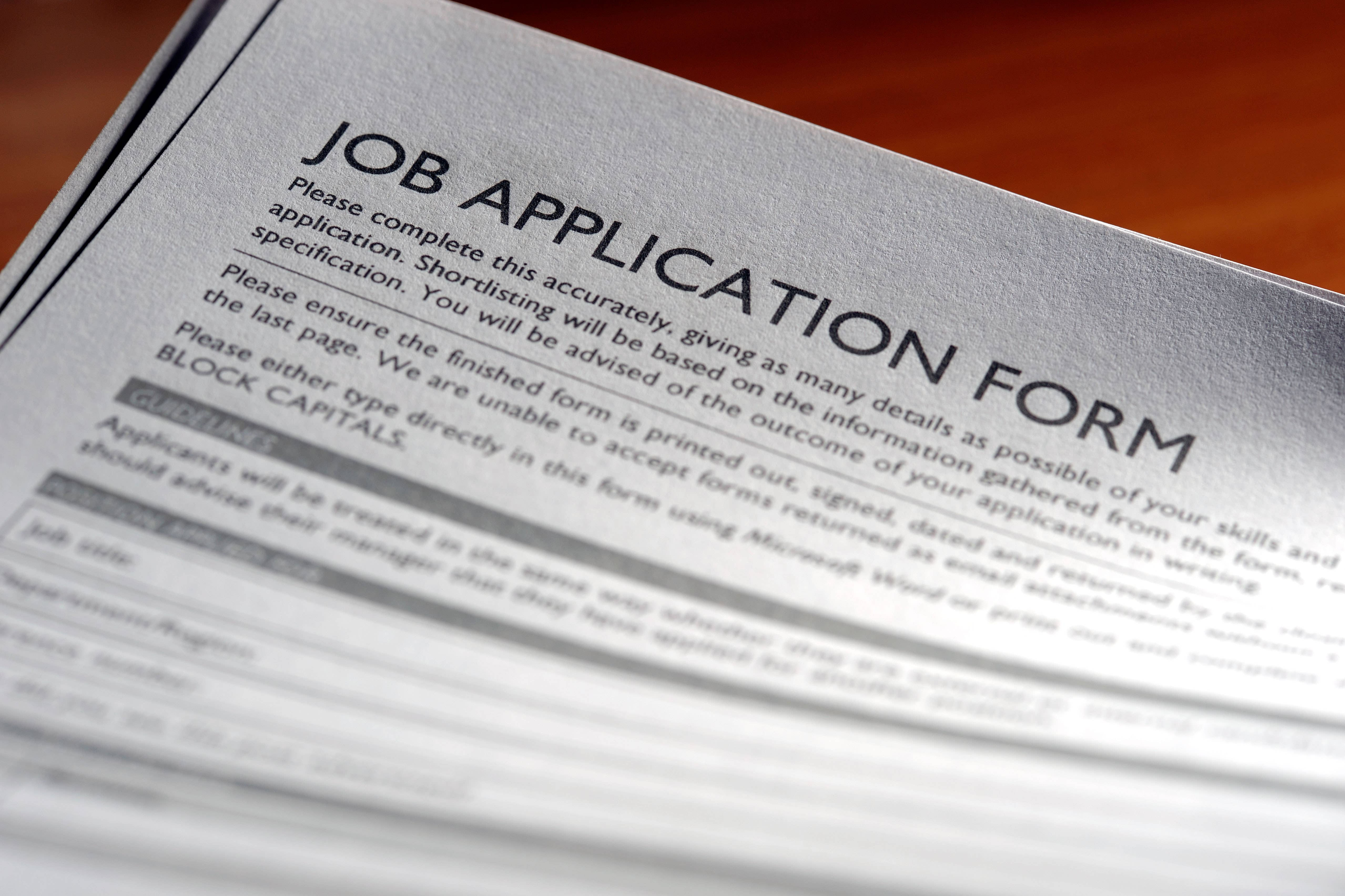 “Job hugging” is a new trend, describing workers who choose to stay at their jobs not out of loyalty or fulfillment at their companies, but rather out of fear or complacency brought on by a volatile job market (stock image)