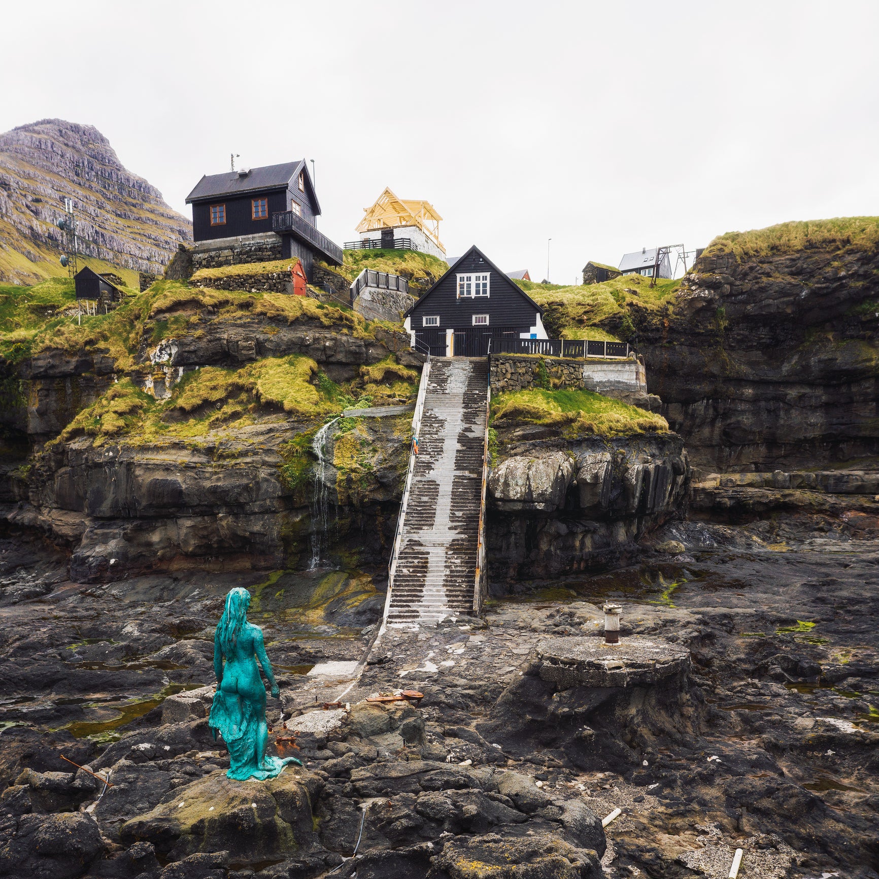The 9ft statue of Kópakonan (The Seal Woman) stands in the Mikladalur Harbour on Kalsoy