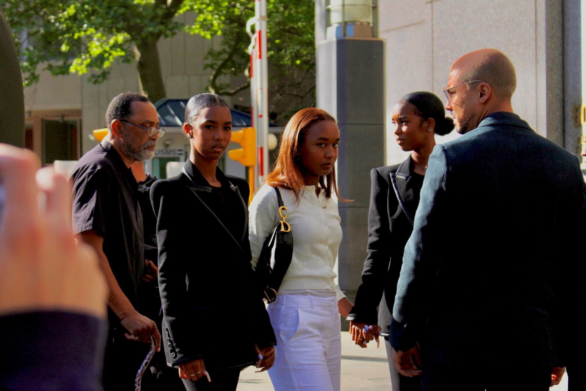 Combs' children, D’Lila, Chance, Jessie, enter the courthouse.