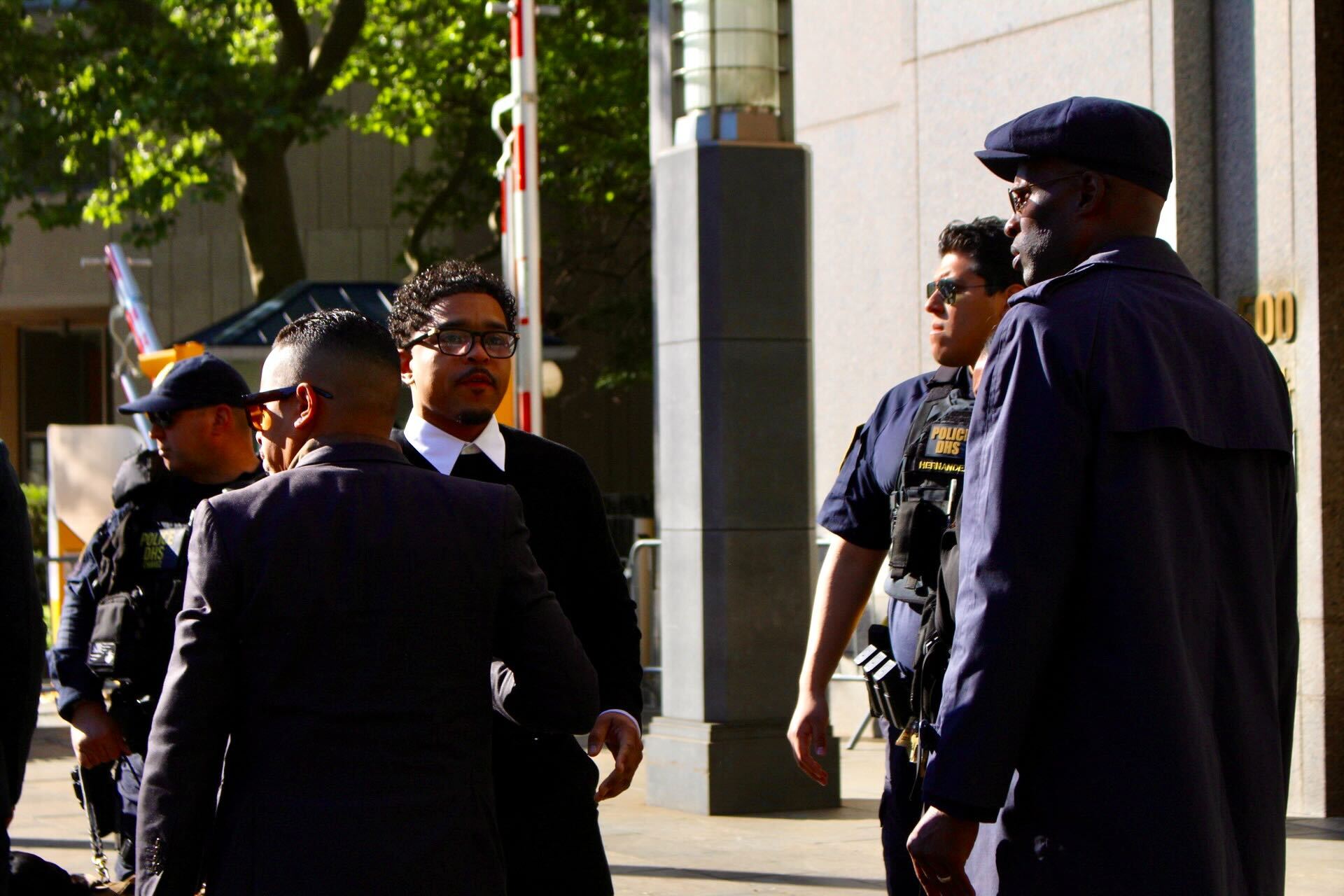 Justin Combs enters the courthouse Monday as opening statements are slated to begin in his father's trial.