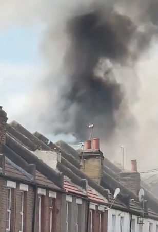 Huge fire rips through homes next to London Tube station 