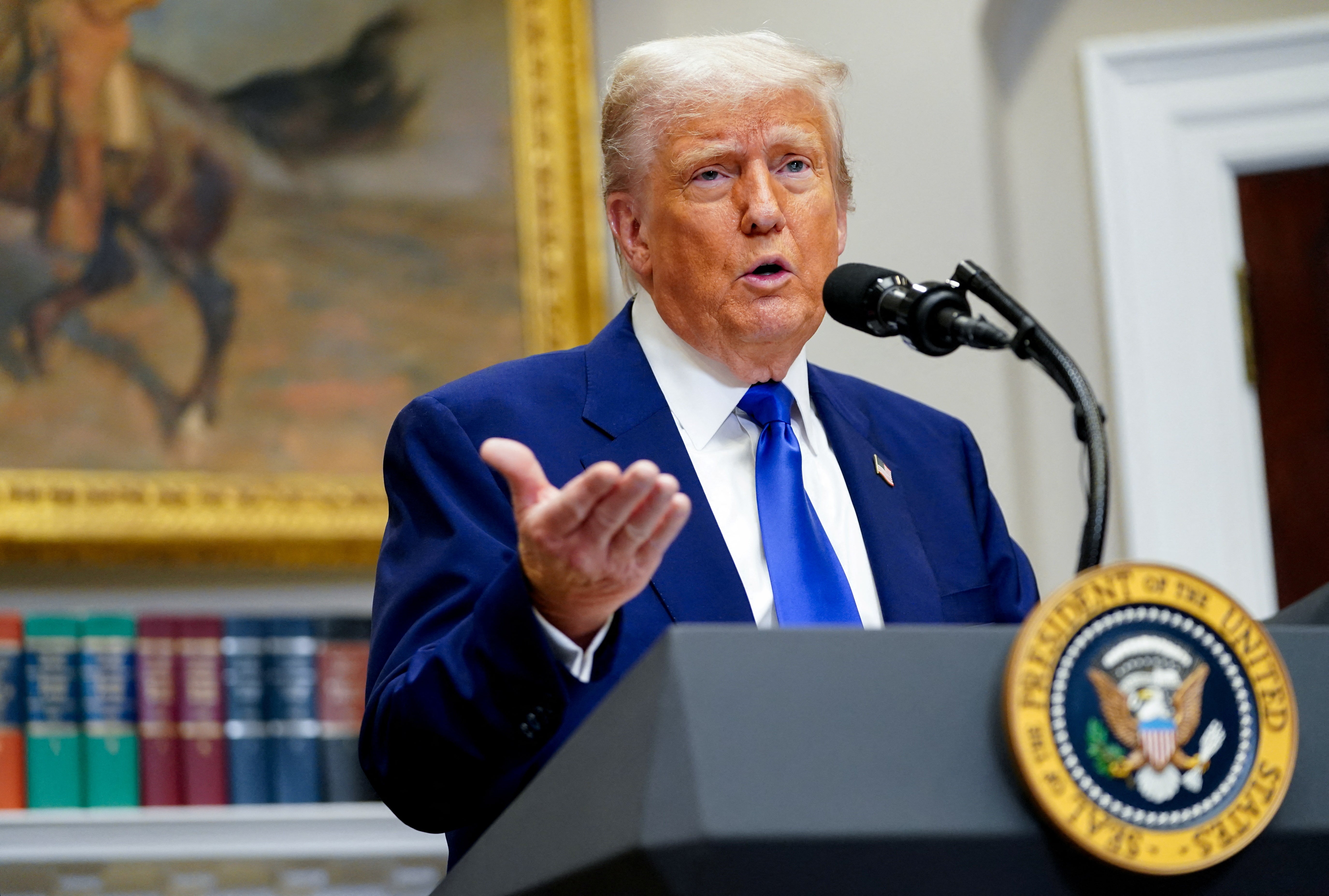 Trump claimed white South Africans are victims of ‘genocide’ as he defended his administration granting them refugee status while stripping refugee admissions for virtually all other groups