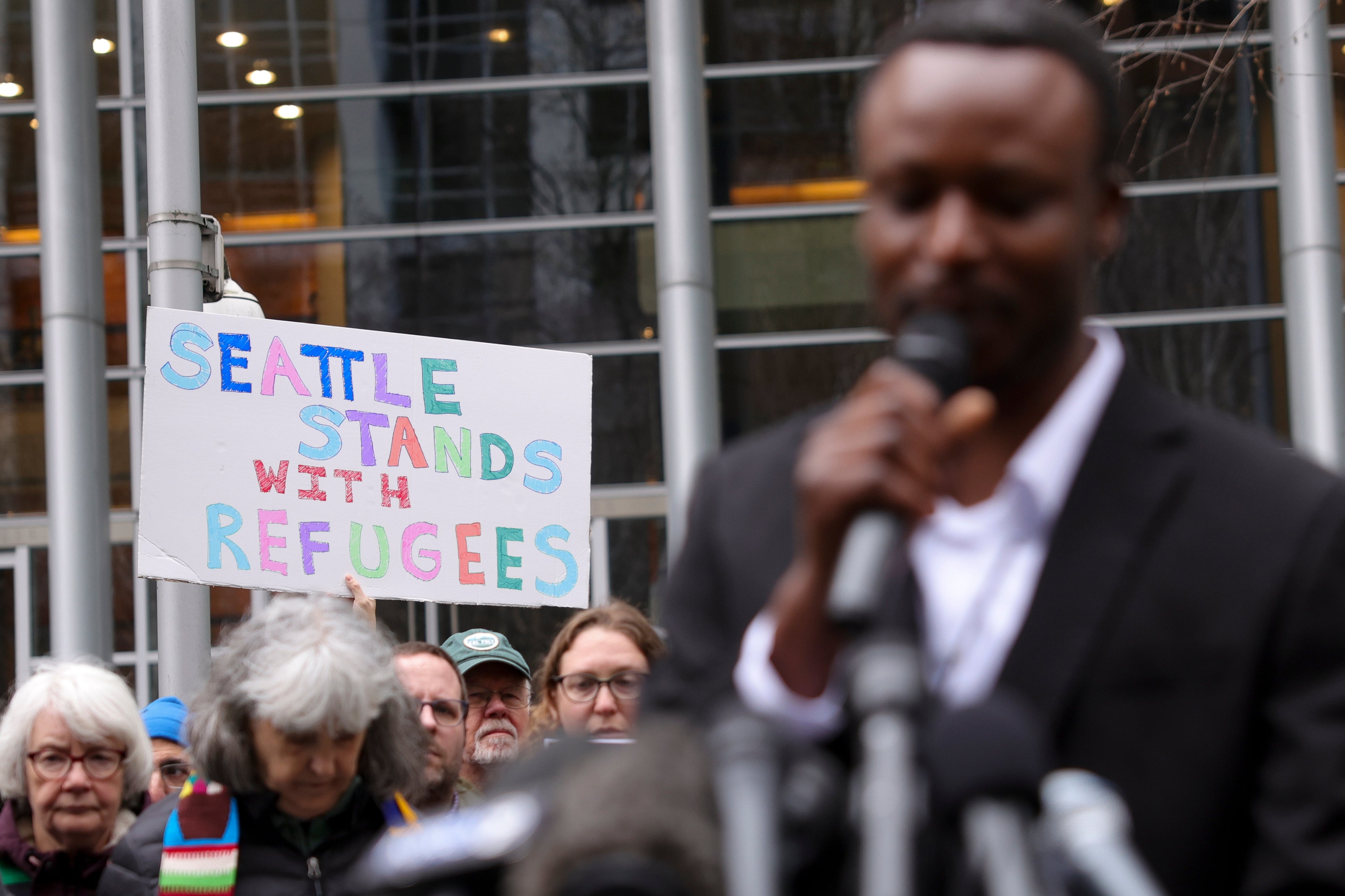 Tshishiku Henry, a former refugee and Washington State Delegate for the Refugee Congress, speaks during a rally outside a federal courthouse after a judge blocked Trump’s effort to halt the nation's refugee admissions system in February