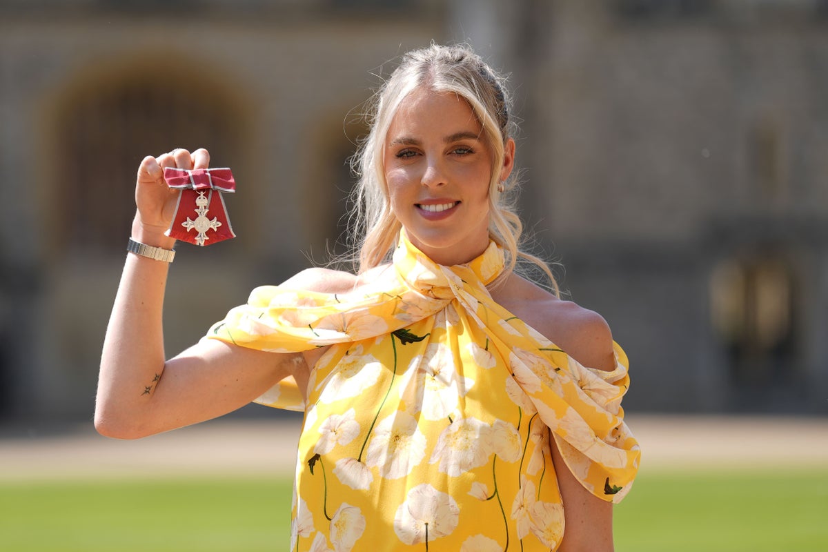 William tells Olympian that Charlotte a keen runner during investiture ceremony