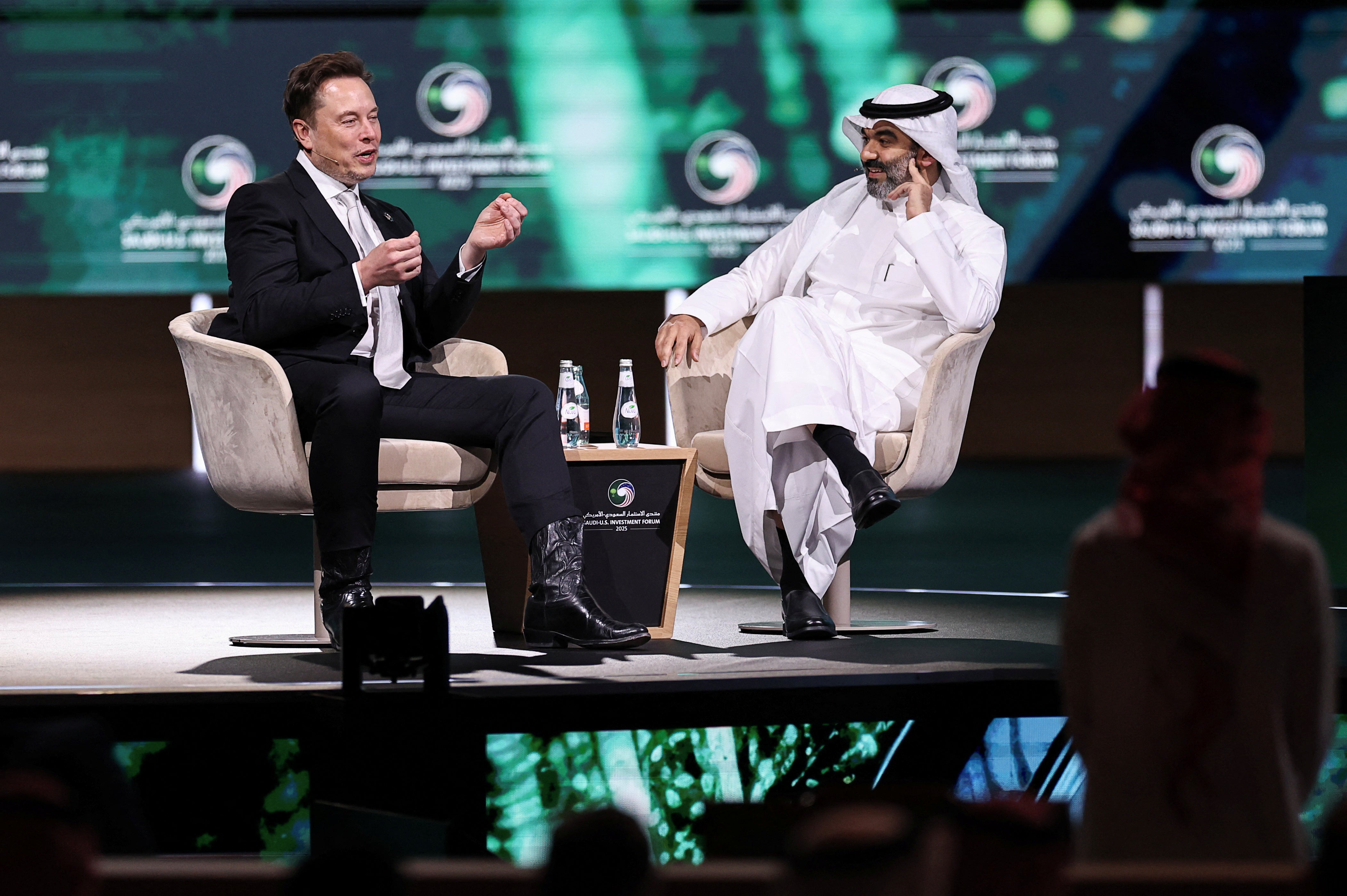 Musk speaks with Saudi Minister of Communications and Information Technology Abdullah Alswaha at the Saudi-U.S. Investment Forum in Riyadh