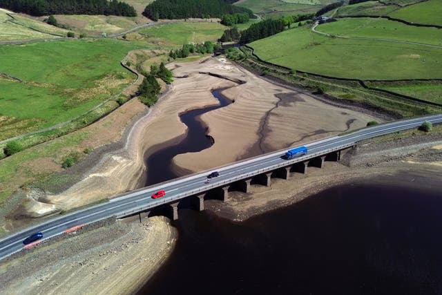 <p>An aerial photograph shows the partially revealed bed of Woodhead Reservoir in Derbyshire</p>