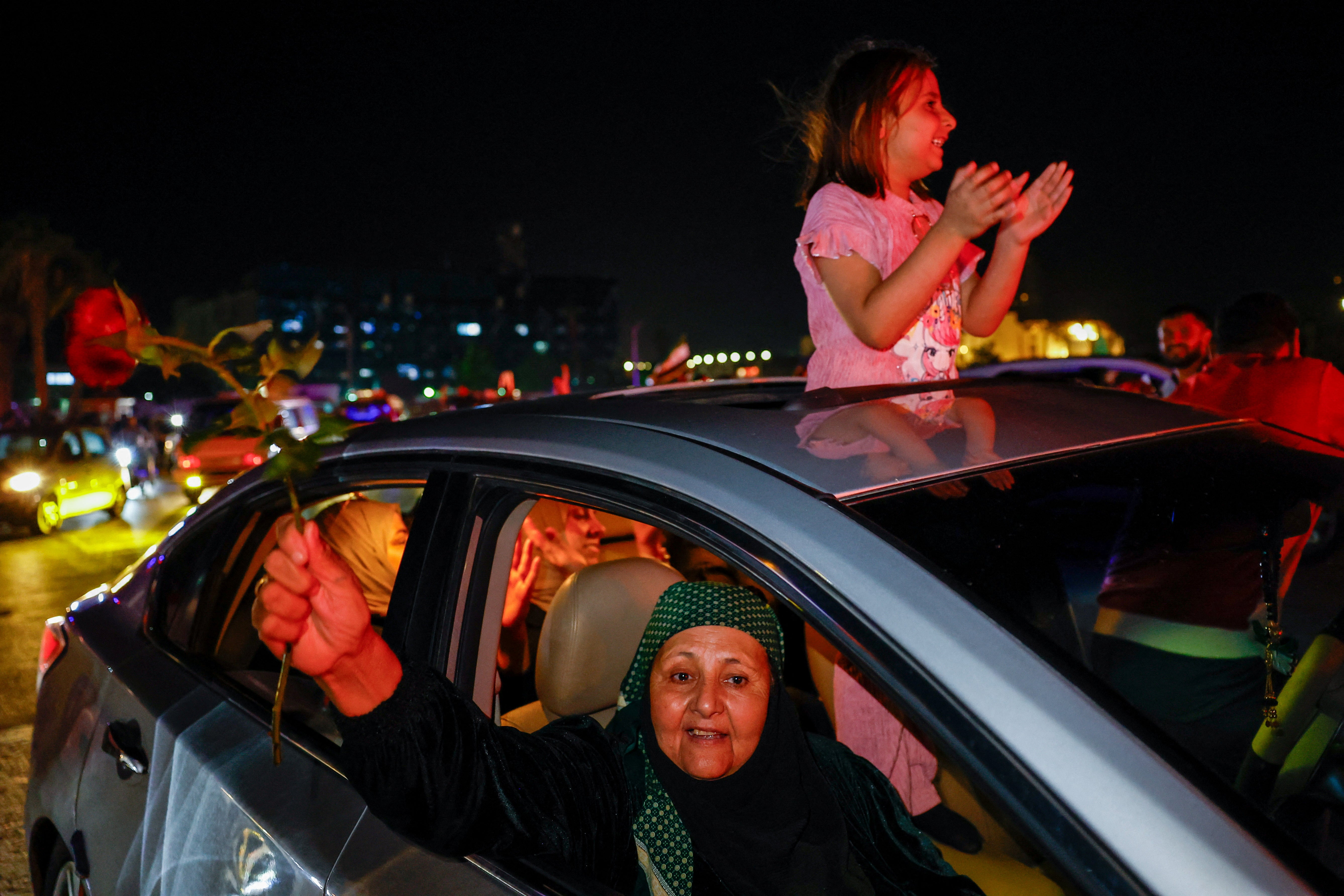People celebrate after U.S. President Donald Trump said on Tuesday he would order the lifting of sanctions on Syria, in Damascus, Syria