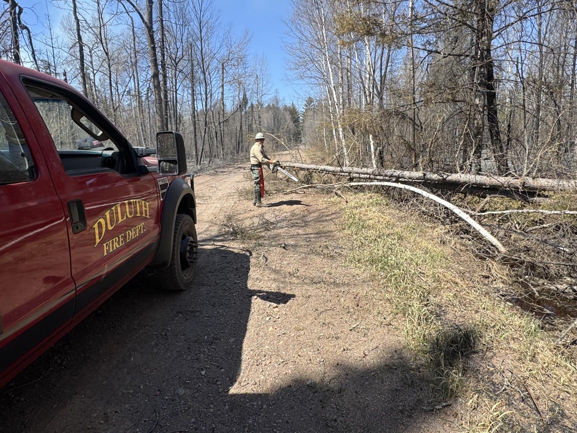 Firefighters are working to fight the fires amid hot and windy conditions. Smoke from the fires has forced air quality alerts