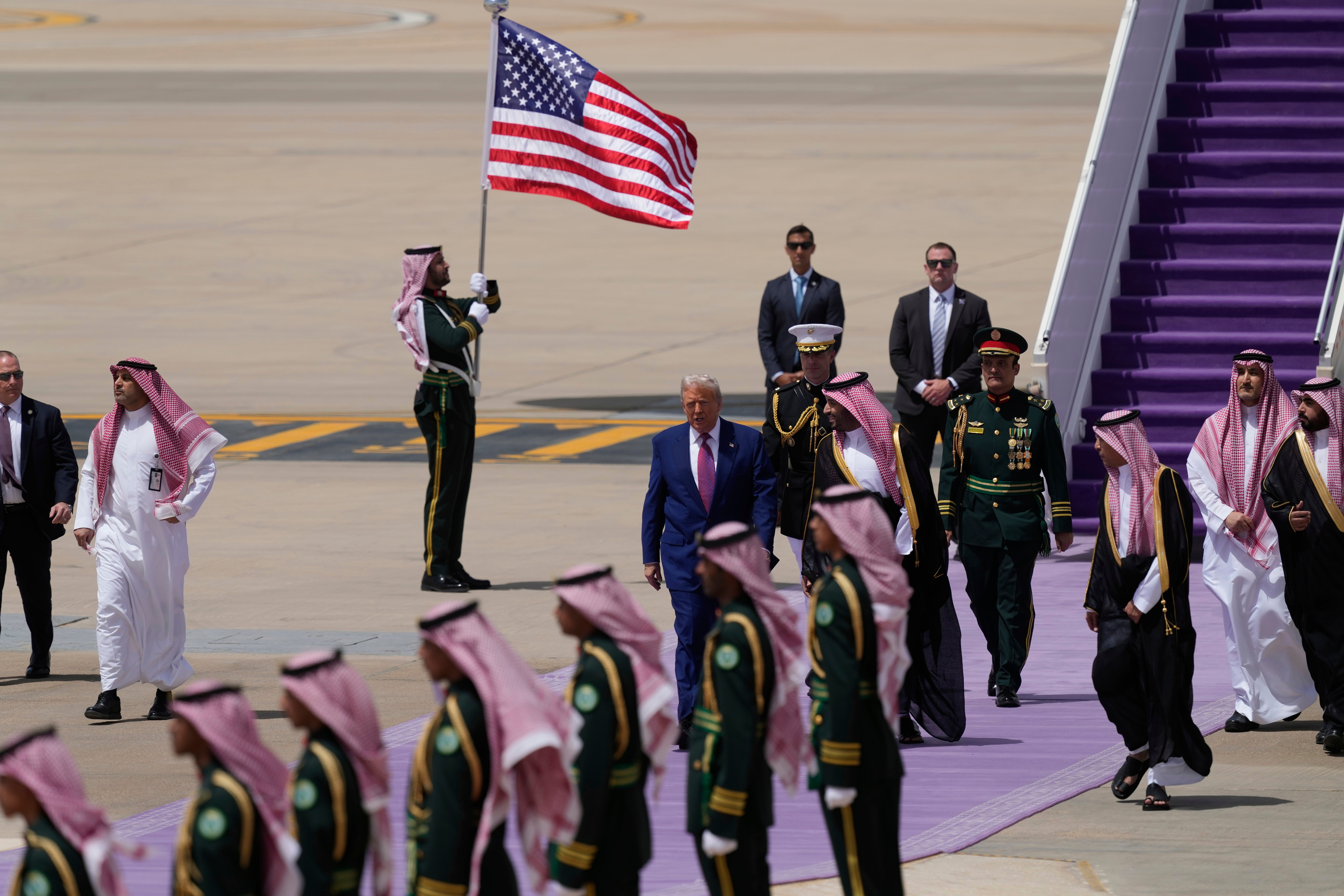 President Donald Trump speaks with Saudi Crown Prince Mohammed bin Salman during an arrival ceremony at the Royal Terminal of King Khalid International Airport in Riyadh, Saudi Arabia, Tuesday, 13 May 2025