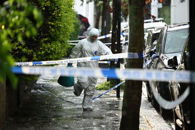 <p>Forensics teams could be seen outside the prime minister’s former home</p>
