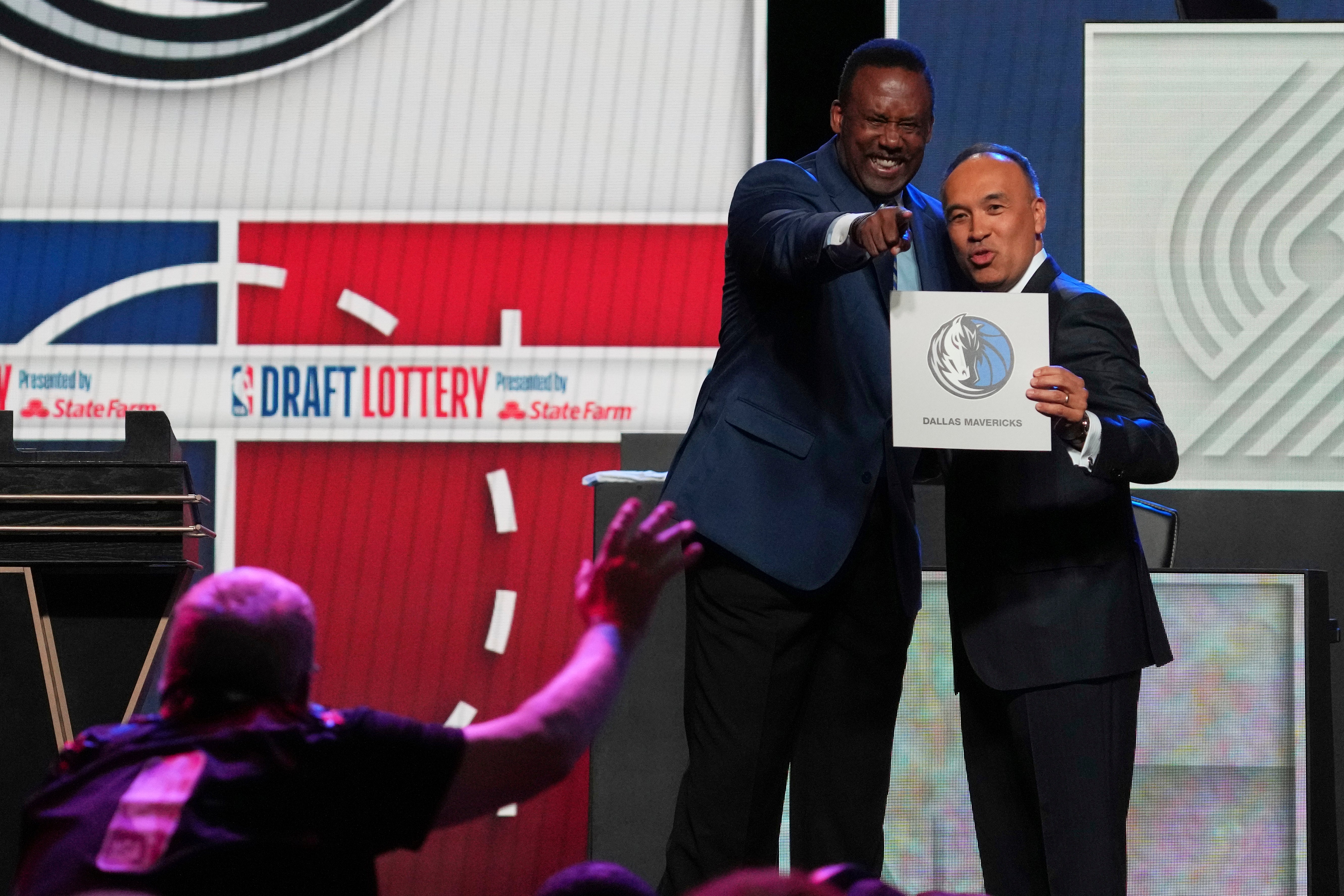 Dallas Mavericks' Rolando Blackman, left, and NBA Deputy Commissioner Mark Tatum pose for photos after Tatum announced that the Mavericks had won the first pick in the NBA basketball draft lottery