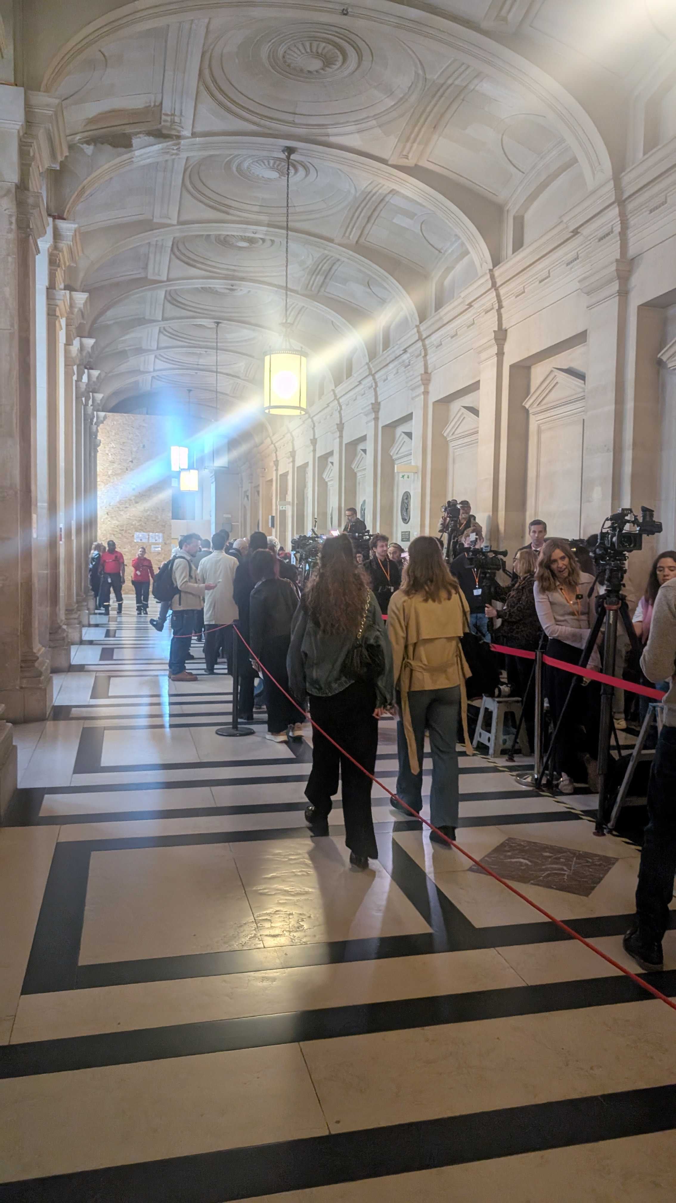Crowds gather inside the courthouse